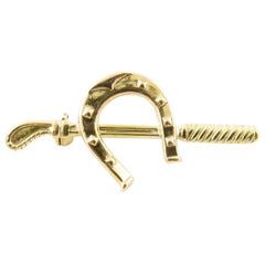 18 Karat Horseshoe and Riding Crop Pin / Brooch