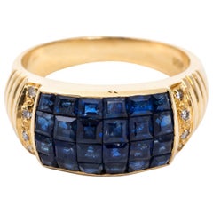 18 Karat Invisible Set Sapphire and Diamond Ring