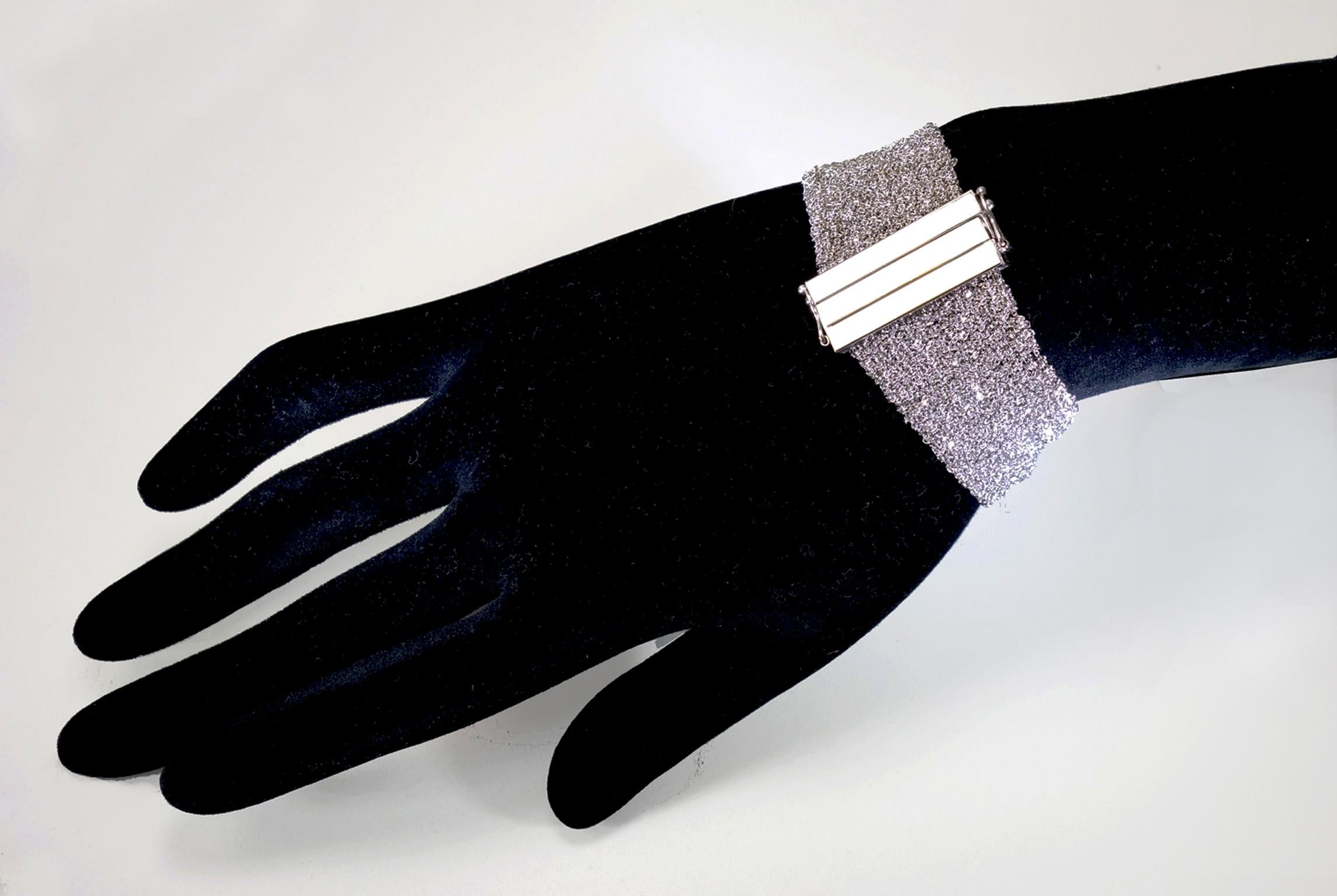 Not your ordinary, this unique bracelet is woven with 18 Karat Italian White Gold so refine that it glitters when reflected light. A box clasp closure created a secure elegant effortless look.  Finished: textured, polished
Dimension: length measured