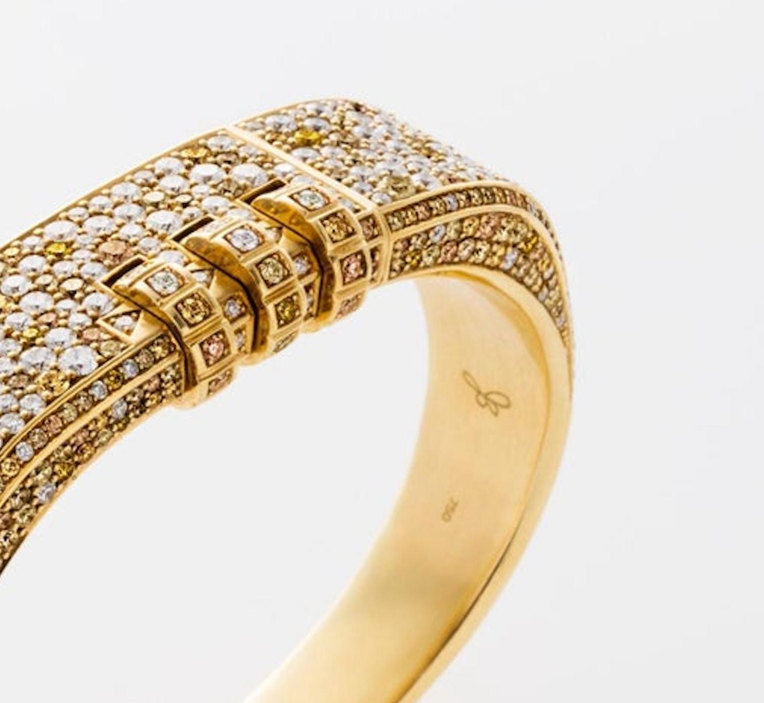 This Made to Order 18 Karat Pave Code Bracelet features a thick solid 18k yellow gold band with your choice of pave precious stones, and a customizable code that opens and locks the bracelet onto the wearer's wrist. 
Lock Combination can be