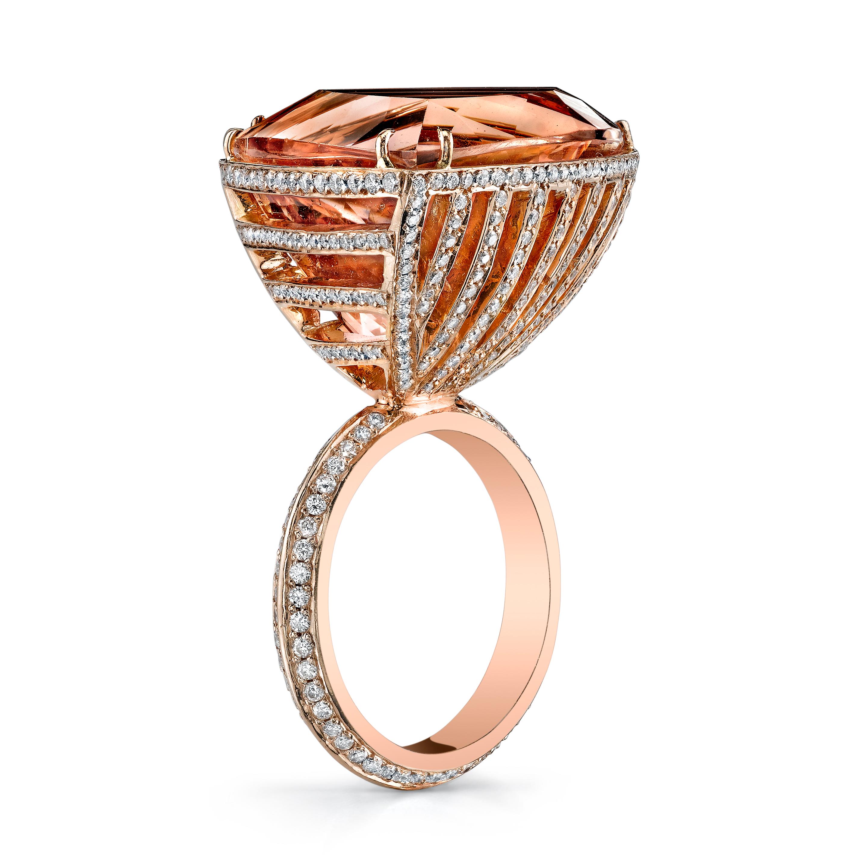 18k Morganite Diamond Linear Ark Ring features a large multi faceted triangular Morganite set in 18k Rose Gold with white diamond pave horizontal and vertical lines and a white diamond pave band 

Looking for the perfect engagement ring? Morganite