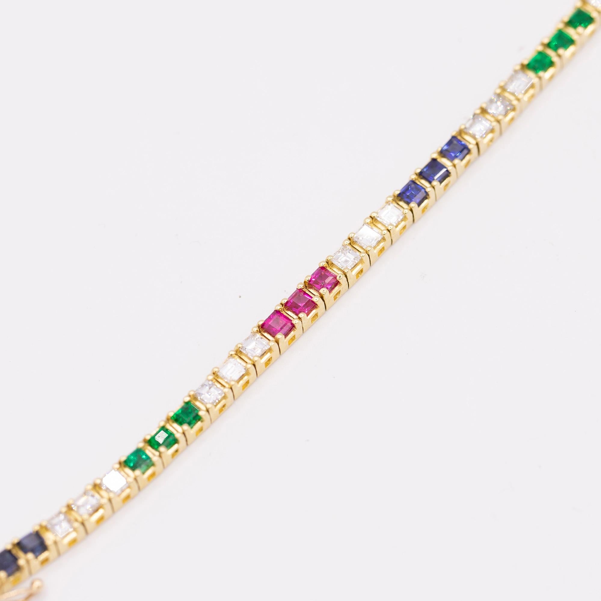 Vintage 18 Karat Yellow Gold Multi-Gem & Diamond line bracelet. The bracelet is featuring 24 square cut diamonds that have a total weight of 2.40 carats. The diamonds are G-H in color & VS2-SI1 in clarity. The 9 square cut emeralds are .72 carats in