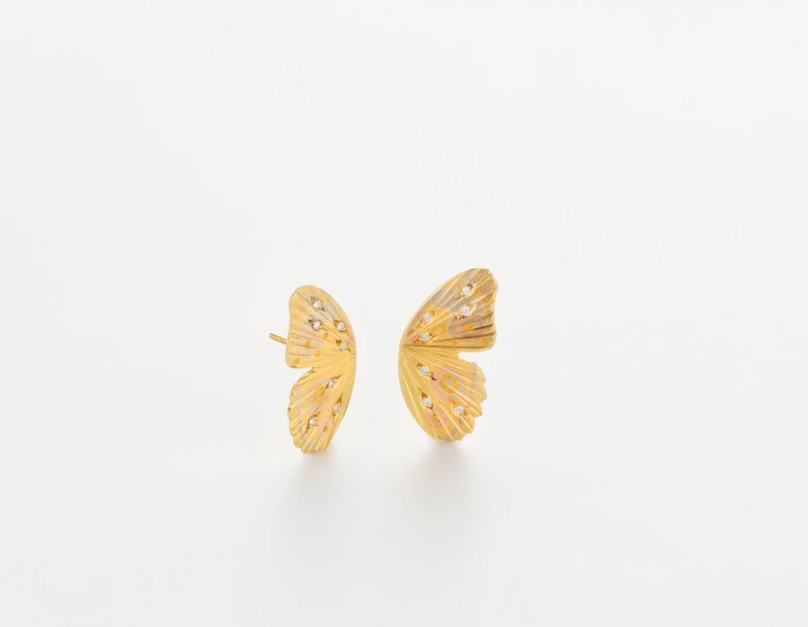 James Banks's signature butterfly earrings feature two Watercolor Buckeye butterfly wings set in 18k Yellow Gold with 18k White Gold, 14k Rose Gold and 24k Yellow Gold inlay and White Diamond Pave with secure push closure backings. 

Handmade in