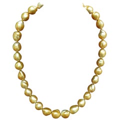 18 Karat Natural South Sea Golden Pearls Necklace 1.50 Carat Diamond Clasp