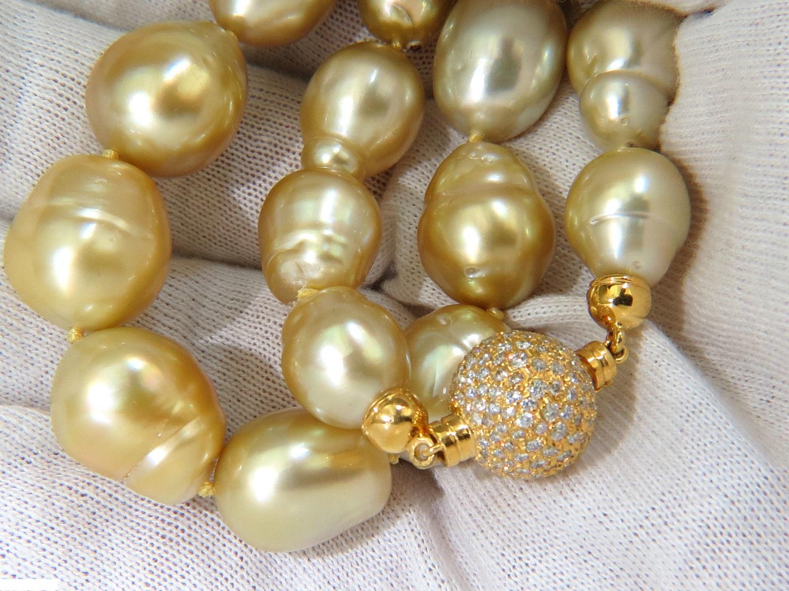 14.6- 12.1mm Natural South Sea yellow pearls necklace.

Amazing vivid sheen and color saturation

No significant dents, pits, nicks or scratches.

18kt. yellow gold 2.00ct. diamond ball bead set clasp

14mm in diameter

G-color, Vs-2 clarity

Total: