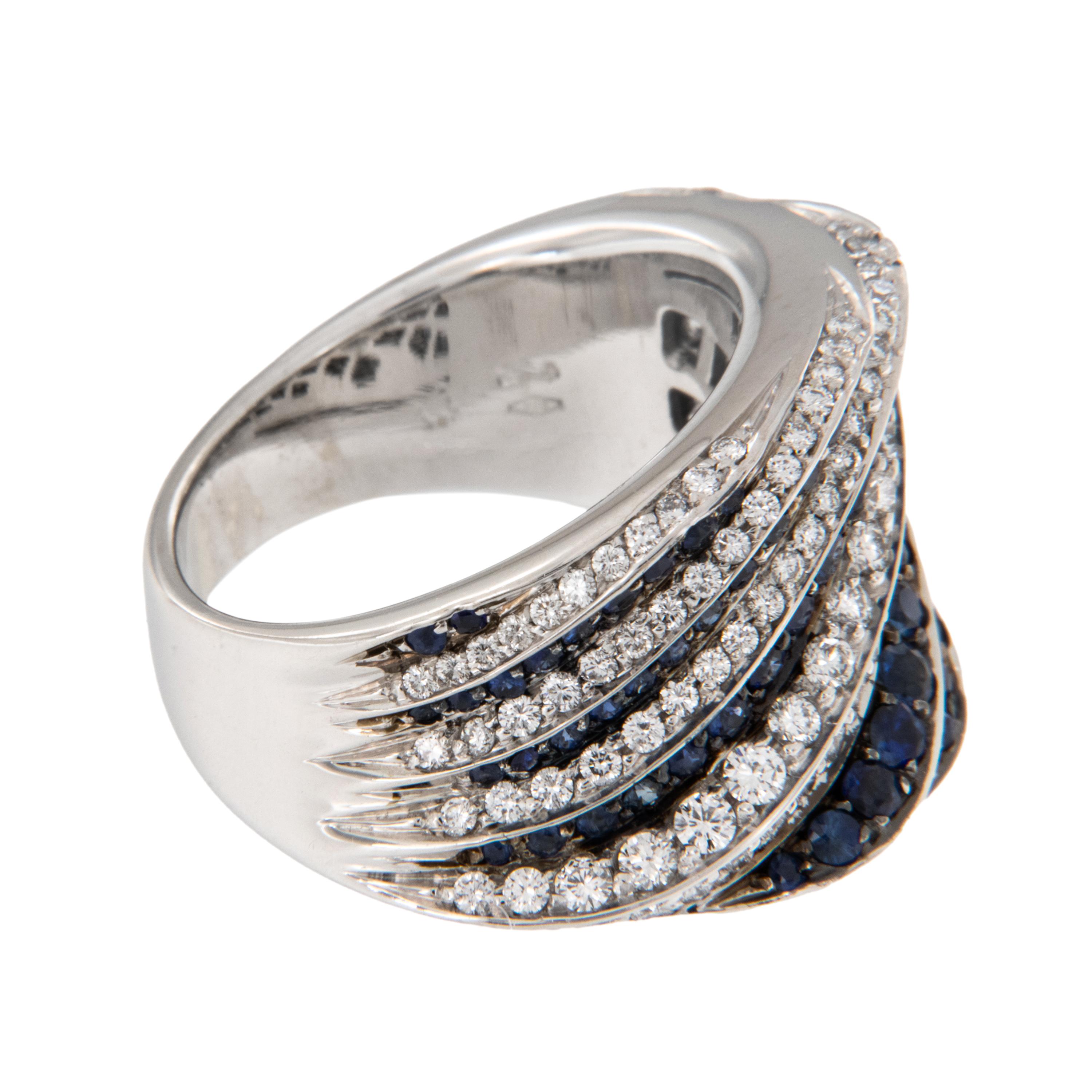 Estate 18 karat white gold and sapphire diamond ring designed and manufactured by New Italian Art, style 2A967Z. Founded in 1969, the partners of NEW ITALIAN ART have a family tradition that goes back to the beginning of the last century. With a