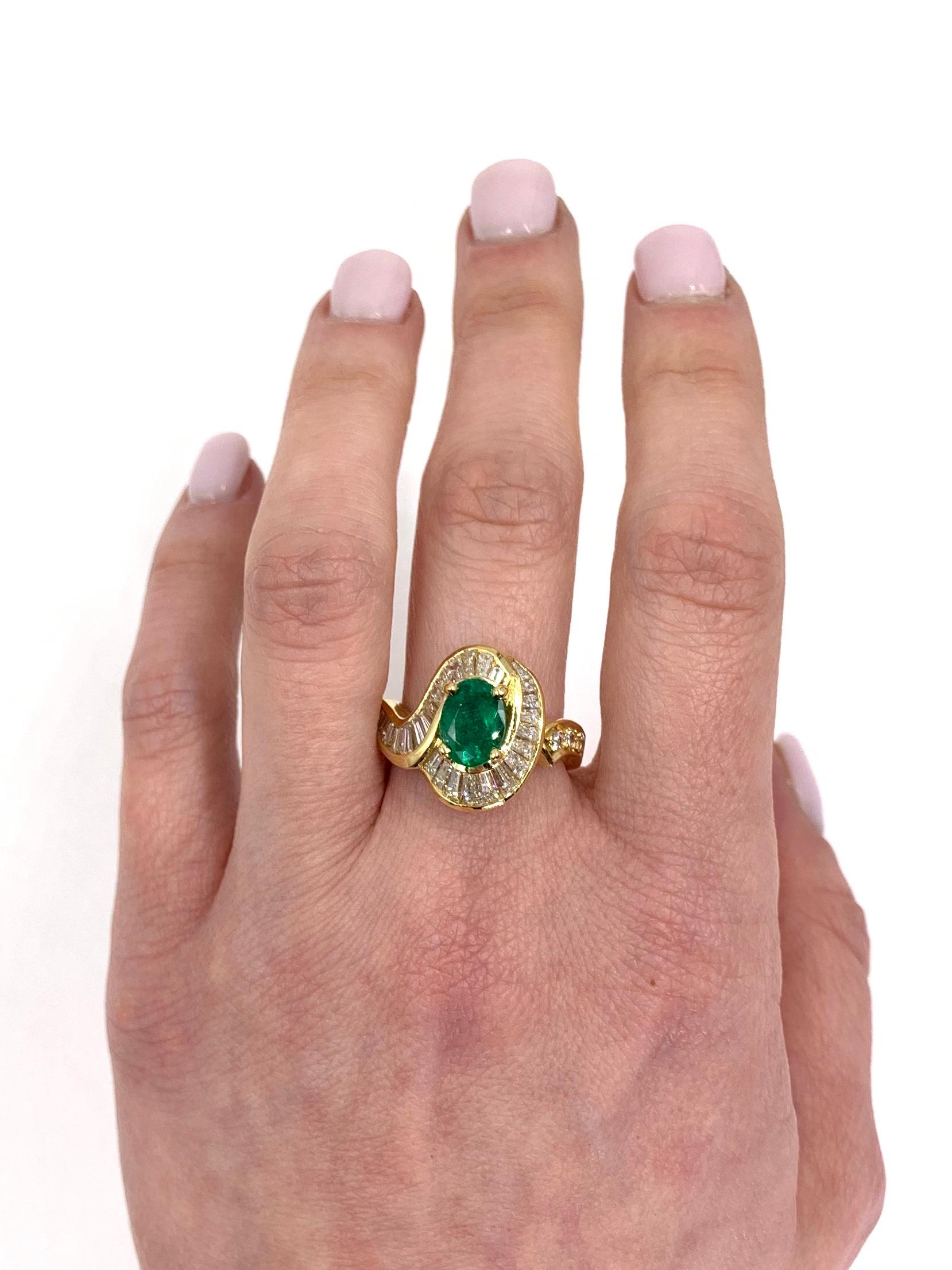 18 Karat yellow gold unique modern ring featuring a 1.22 carat oval genuine emerald surrounded by channel set baguette diamonds and accented with 3 round brilliant diamonds. Diamond total weight is 1.90 carats at approximately G-H color, VS2