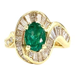 18 Karat Oval 1.22 Carat Emerald and Diamond Ring