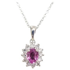Colgante ovalado de zafiro rosa y diamante de 18 quilates