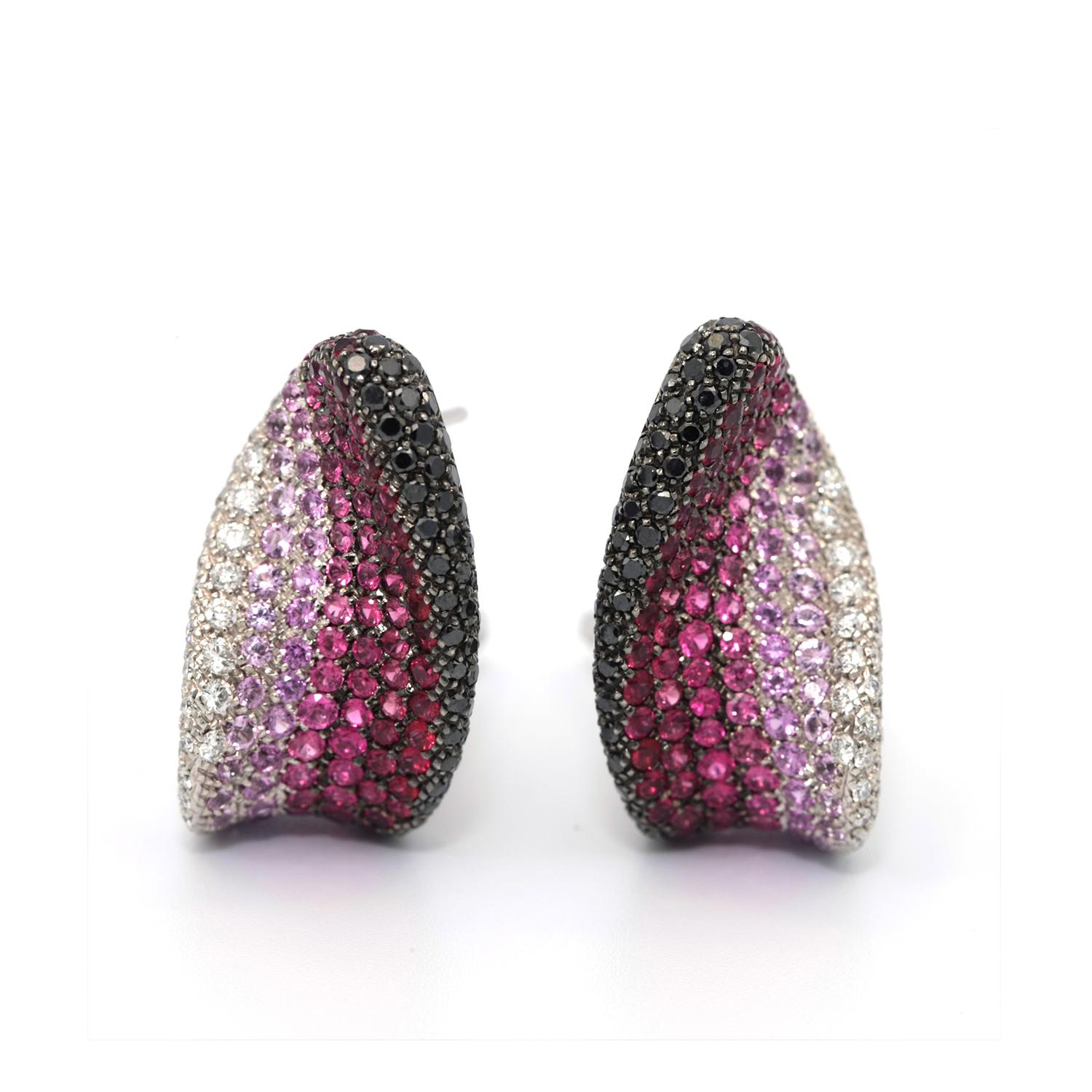 These earrings features river flow motif are paved with full-cut white diamonds and black diamonds, along with red rubies and pink sapphires.
White 18k Gold 
Weight: 20.68 Grams
White Diamonds Total weight: 0.98 cts
Black Diamonds Total weight: 1.22