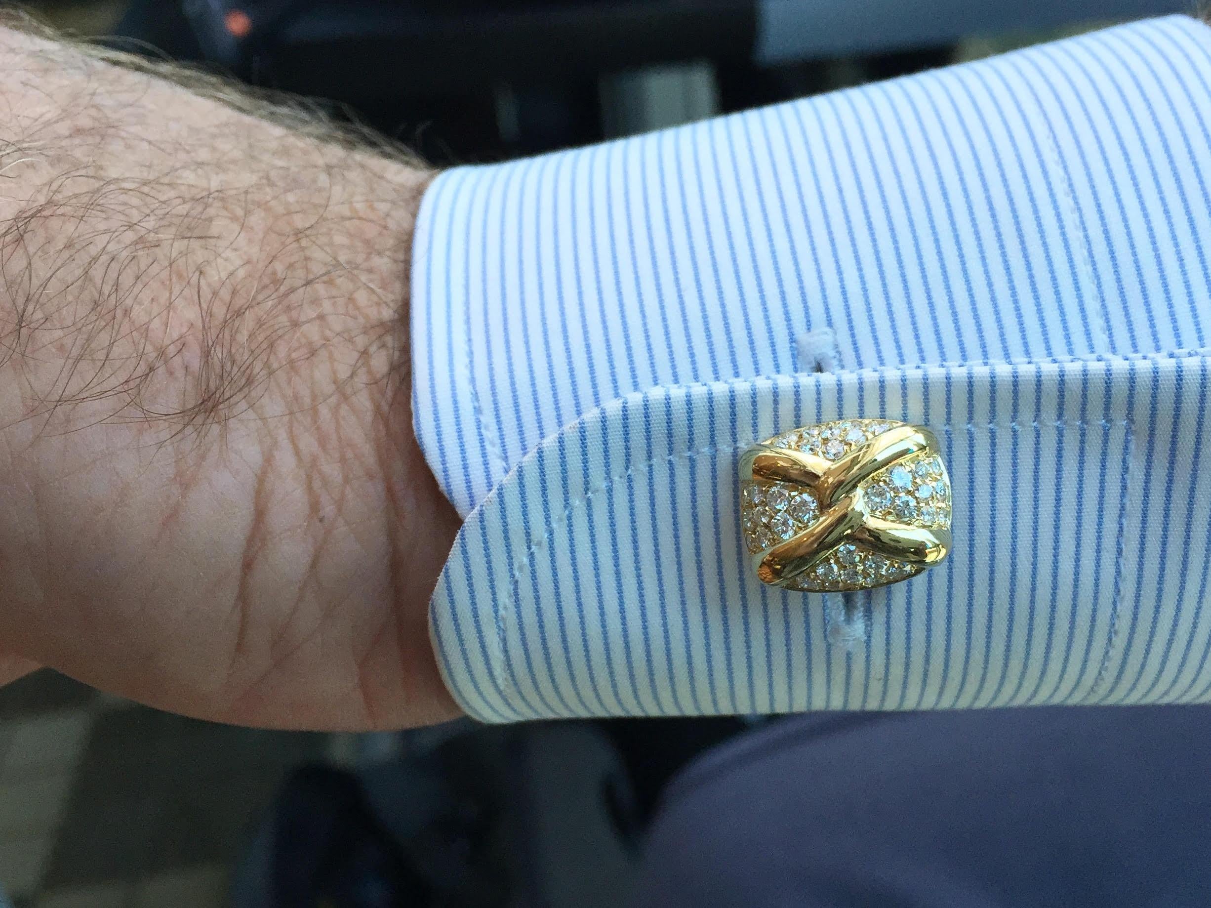 Exquisite quality and style by jewelry designer, Giovane. These vintage 18 karat yellow gold X design cuff links are adorned with 1.61 carats of round brilliant diamonds (approximately F color, VS clarity). The toggle clasp part of the cuff link