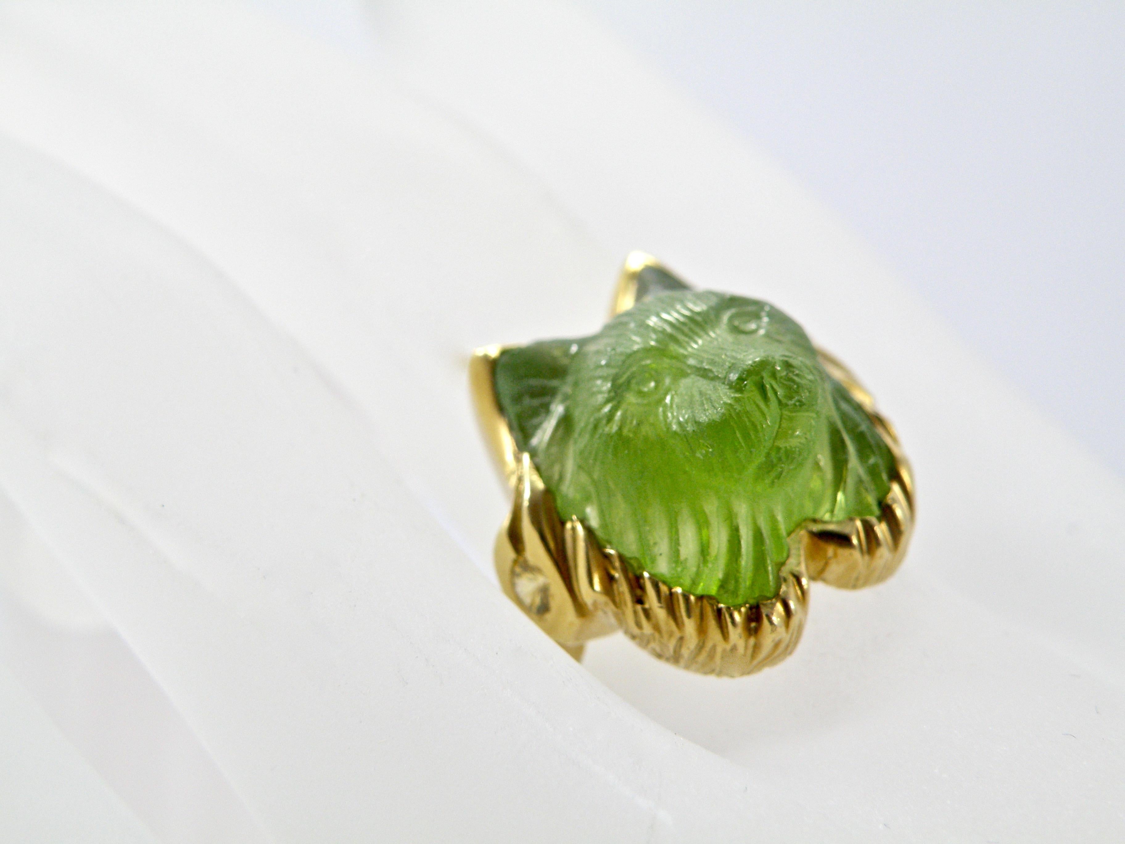 18 Karat Hand carved Peridot Lynx Ring with yellow sapphire eternity band