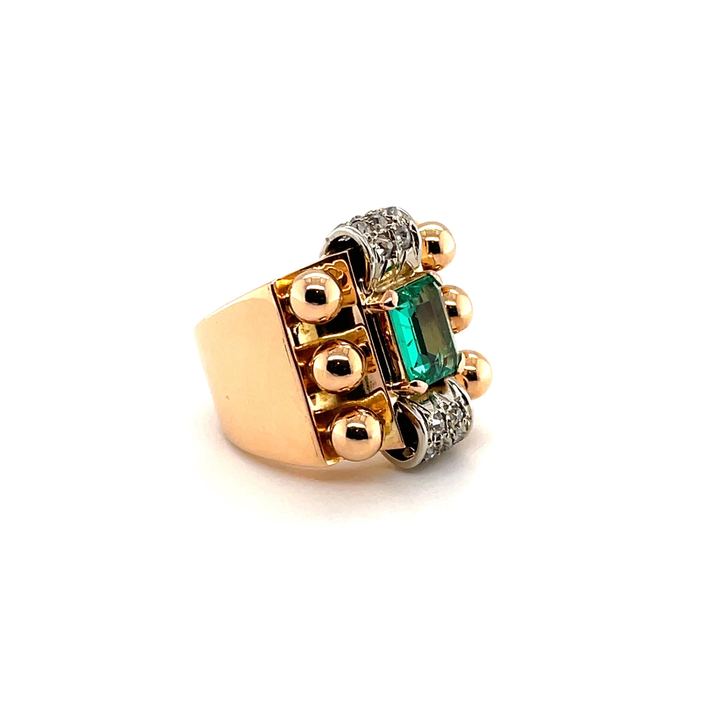 18 karat pink and white gold emerald and diamond Retro cocktail ring, circa 1940. 

Charming Retro cocktail ring of geometric design, centering upon one octagonal emerald of circa 0.9 carats, flanked by two scroll motifs in white gold, decorated