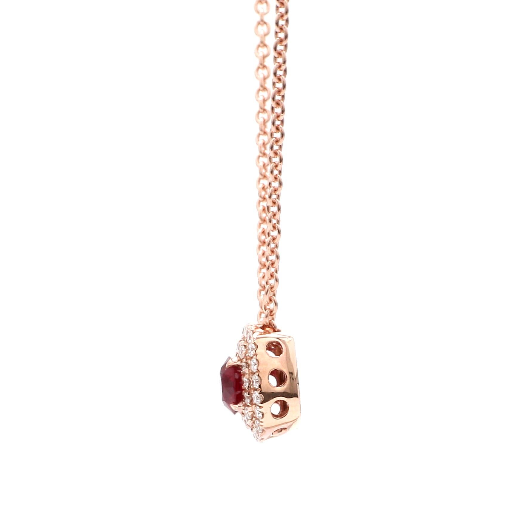 A Beautiful Handcrafted Necklace in 18 Karat Pink Gold with Natural & Ethically Mined Mozambique No Heat Diamond Cut Ruby in a Double Halo Diamond Necklace with 18