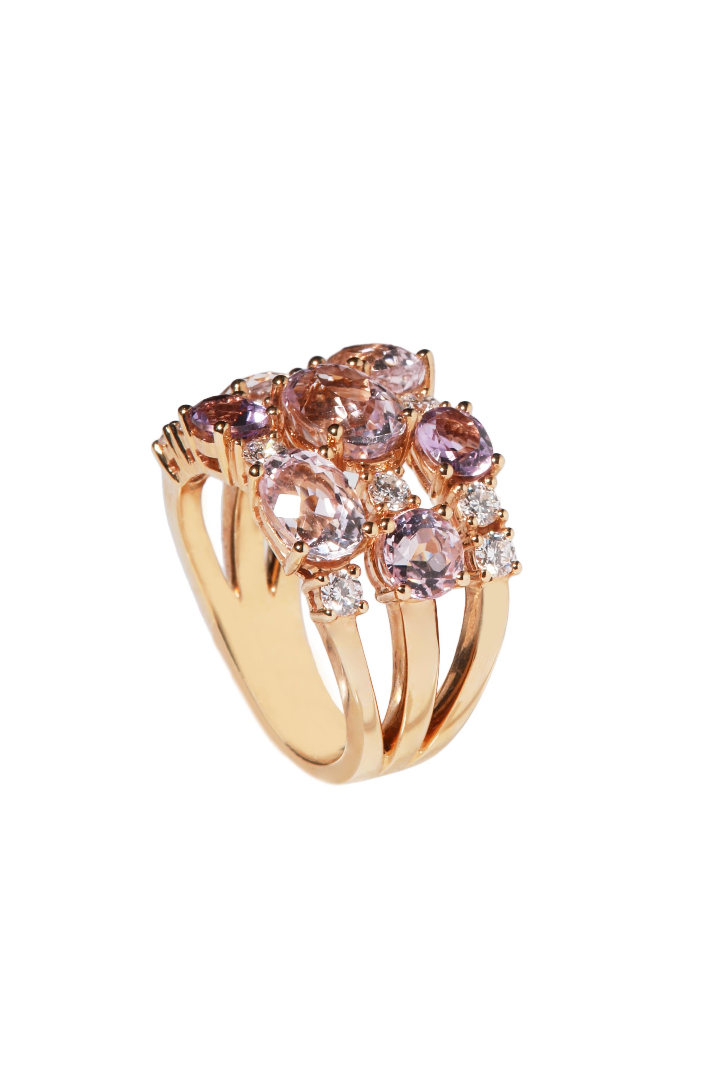 18kt rose gold ring is set with round and oval cut amethysts and kunzites, a total of 5.42 carat of gemstones.
Sparkly brilliant cut diamonds, a total of 0.63 carat, are set in between the pink to violet-pink soft tones, creating a wonderful festive