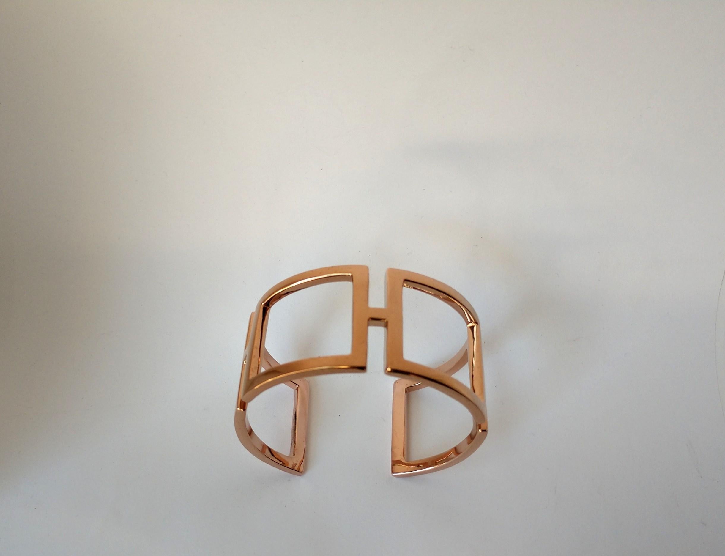 18 Karat Pink Gold Vermeil Rectangle Cuff Bracelet , 3 x 1.5 mm thick x  mm 1 3/16ths inch  wide. This is one of my early designs.  I was using the simple rectangle in a curved state for the ultimate in expression of sculpture and a piece of