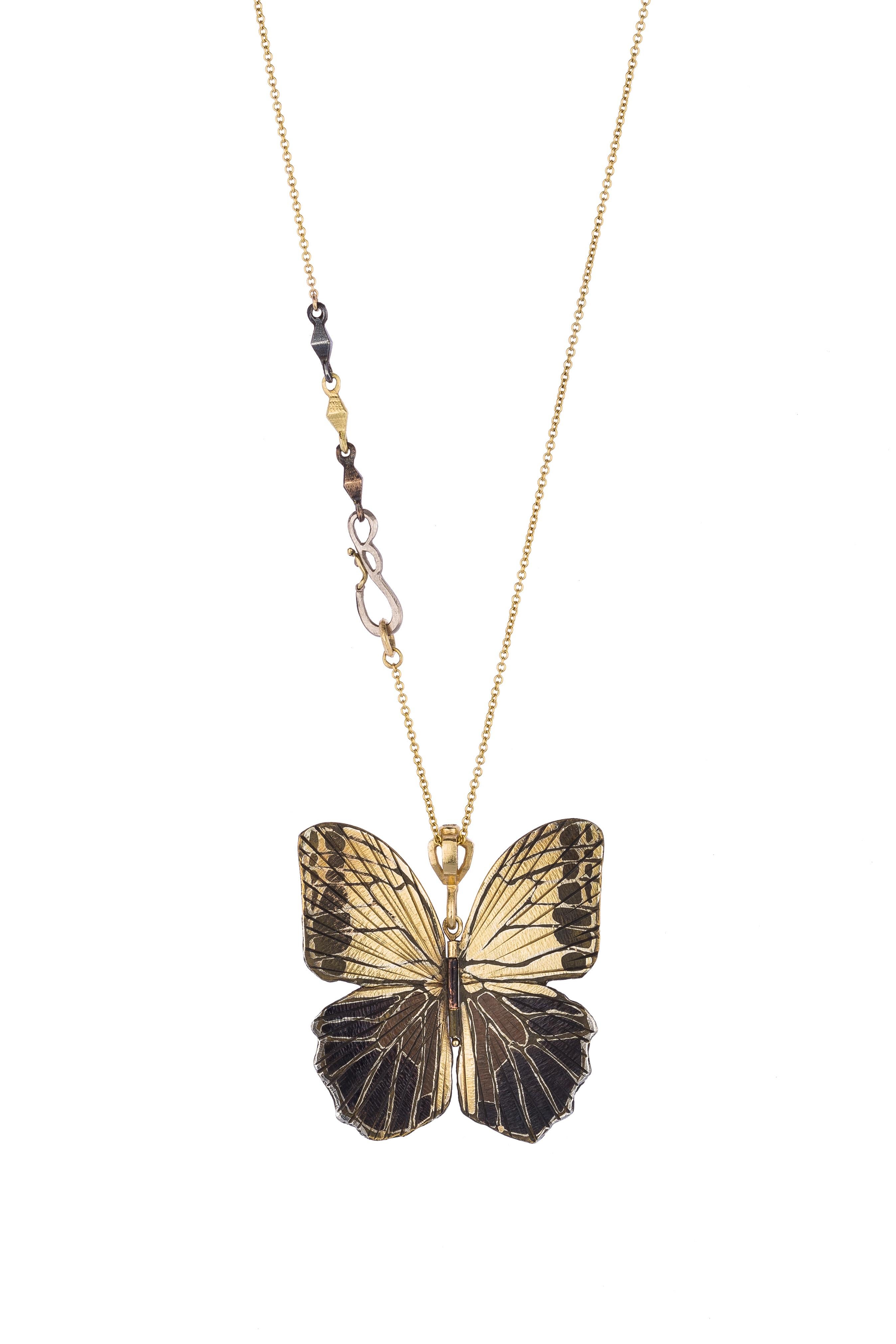 James Banks's signature butterfly necklace features a Large Owl Butterfly with a hinge at the center to allow movement of the wings, set in 18k Yellow Gold with Shakudo and Platinum, 18k White Gold, 14k Rose Gold, Sterling Silver, and Copper Inlay,