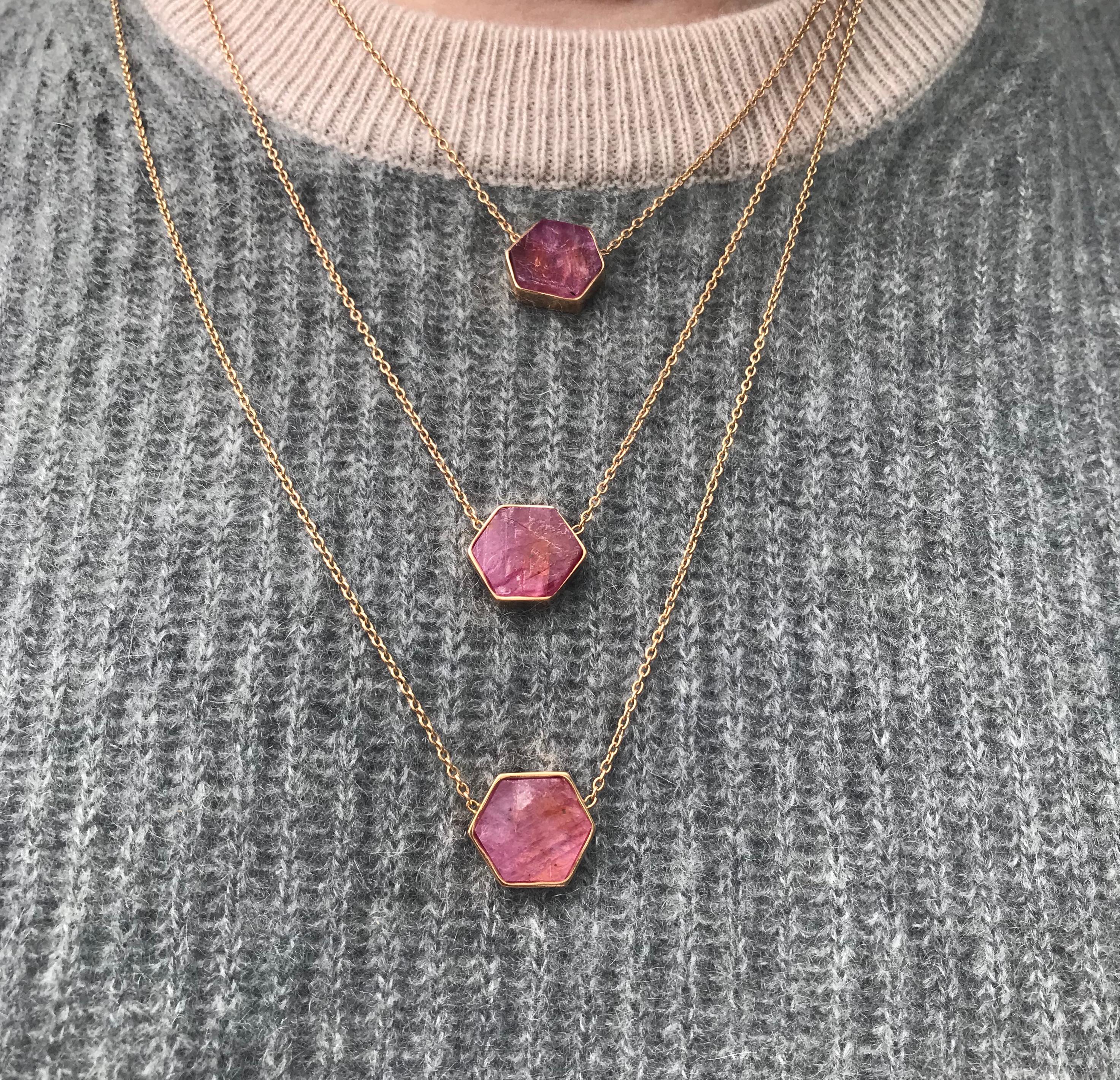 18 Karat Raw Ruby necklace features a custom geometric cut natural ruby chunk framed by an 18k Rose Gold Bezel and hung on a 24 inch 18k Rose Gold chain. 
Includes lobster clasp closure at back of the neck
18k Rose Gold, Natural Ruby
From Karma El