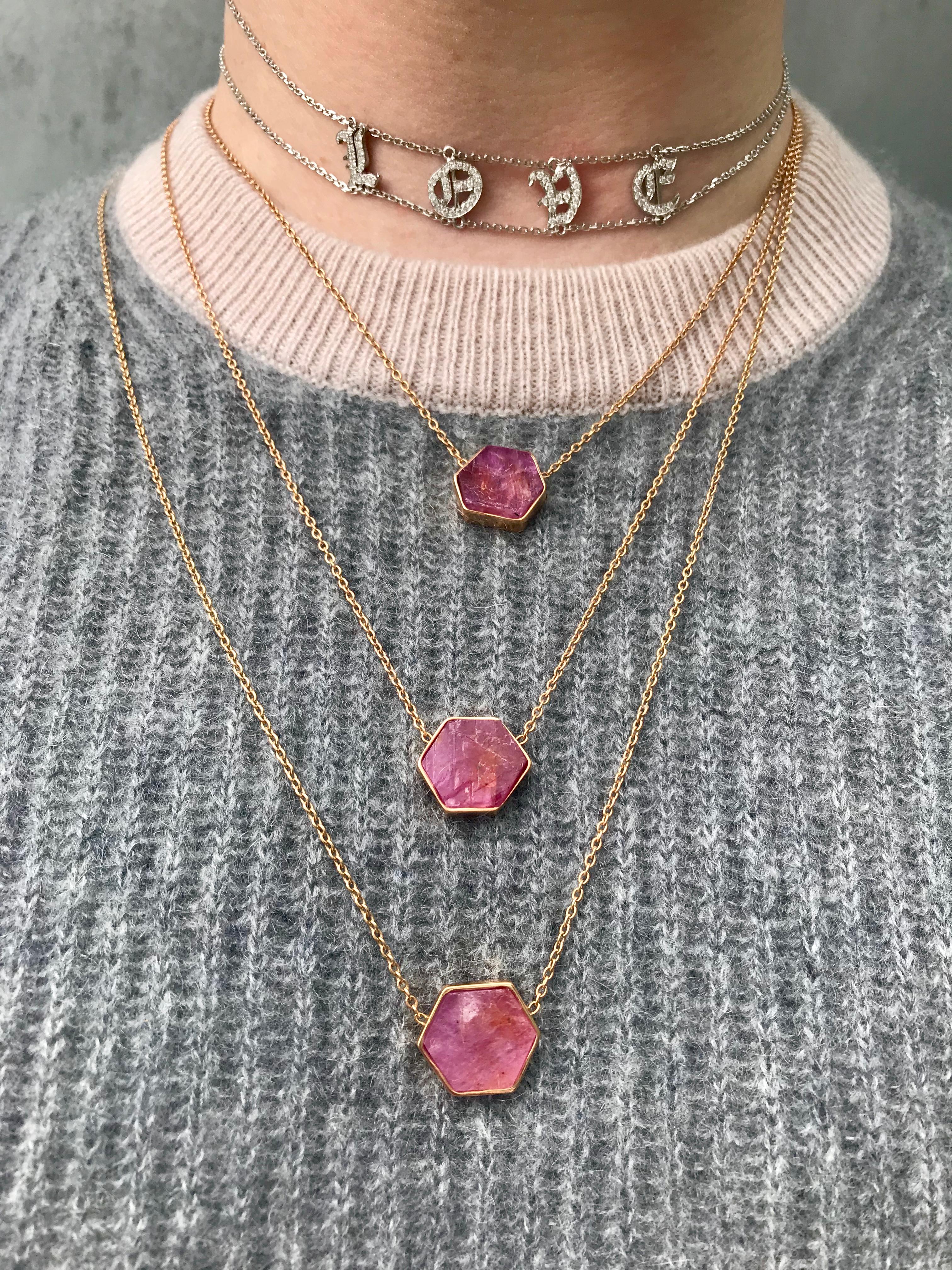 18 Karat Raw Ruby necklace features a custom geometric cut natural ruby chunk framed by an 18k Rose Gold Bezel and hung on a 28 inch 18k Rose Gold chain. 
Includes lobster clasp closure at back of the neck
18k Rose Gold, Natural Ruby
From Karma El