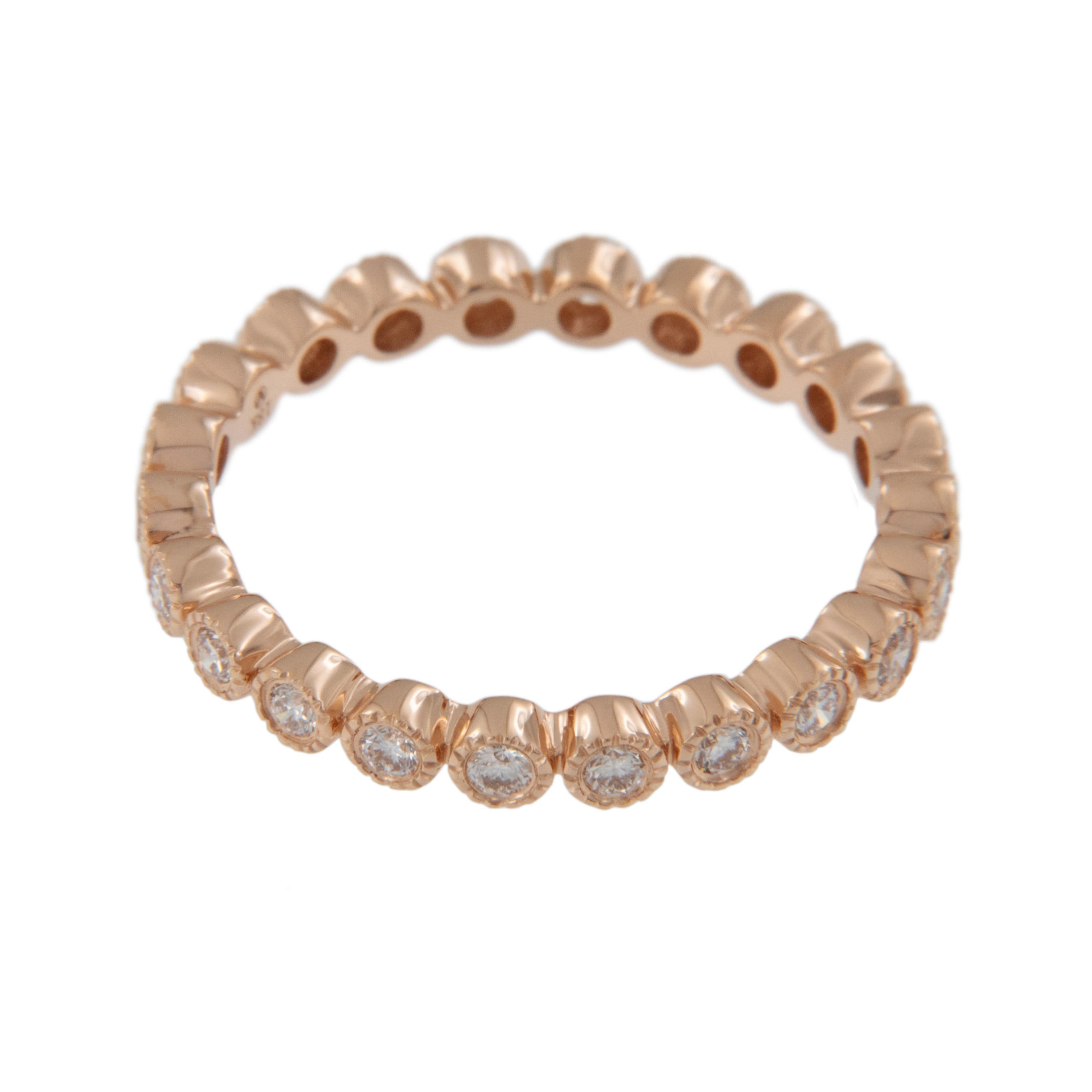 Created from warm 18 karat rose gold, this beautiful eternity band boasts 23 fine round brilliant cut diamonds = 0.42 Cttw each individually set in milgrain edged bezels for a stunning look on its own or check out our white and rose gold matching