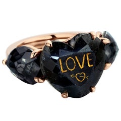 18 Karat Rose Gold 11.22 Carat Heart Shape Black Diamond Trilogy Ring