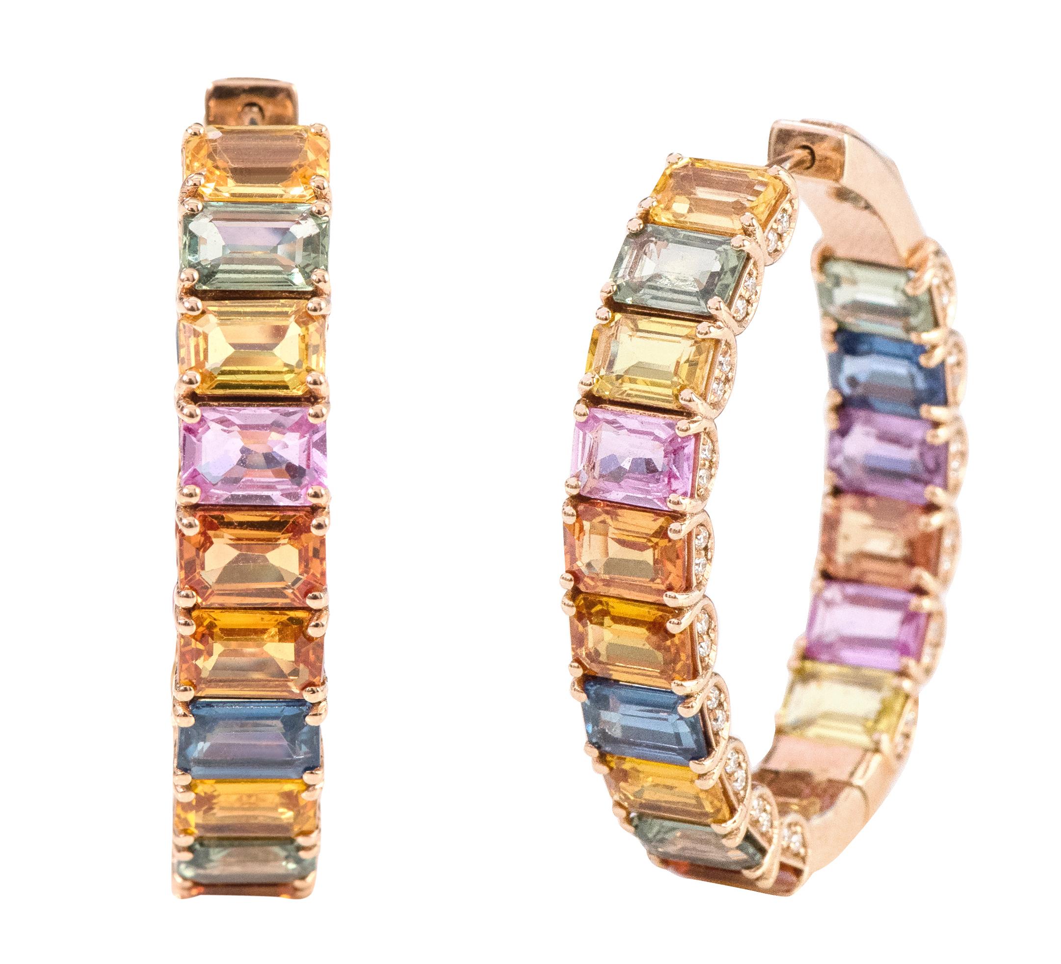 18 Karat Rose Gold 21.26 Carat Multi-Color Sapphire and Diamond Hoop Earrings

This marvelous rainbow multi-sapphire and side diamond full hoop is alluring. The solitaire horizontally placed emerald cut multi-sapphires in grain prong rose gold