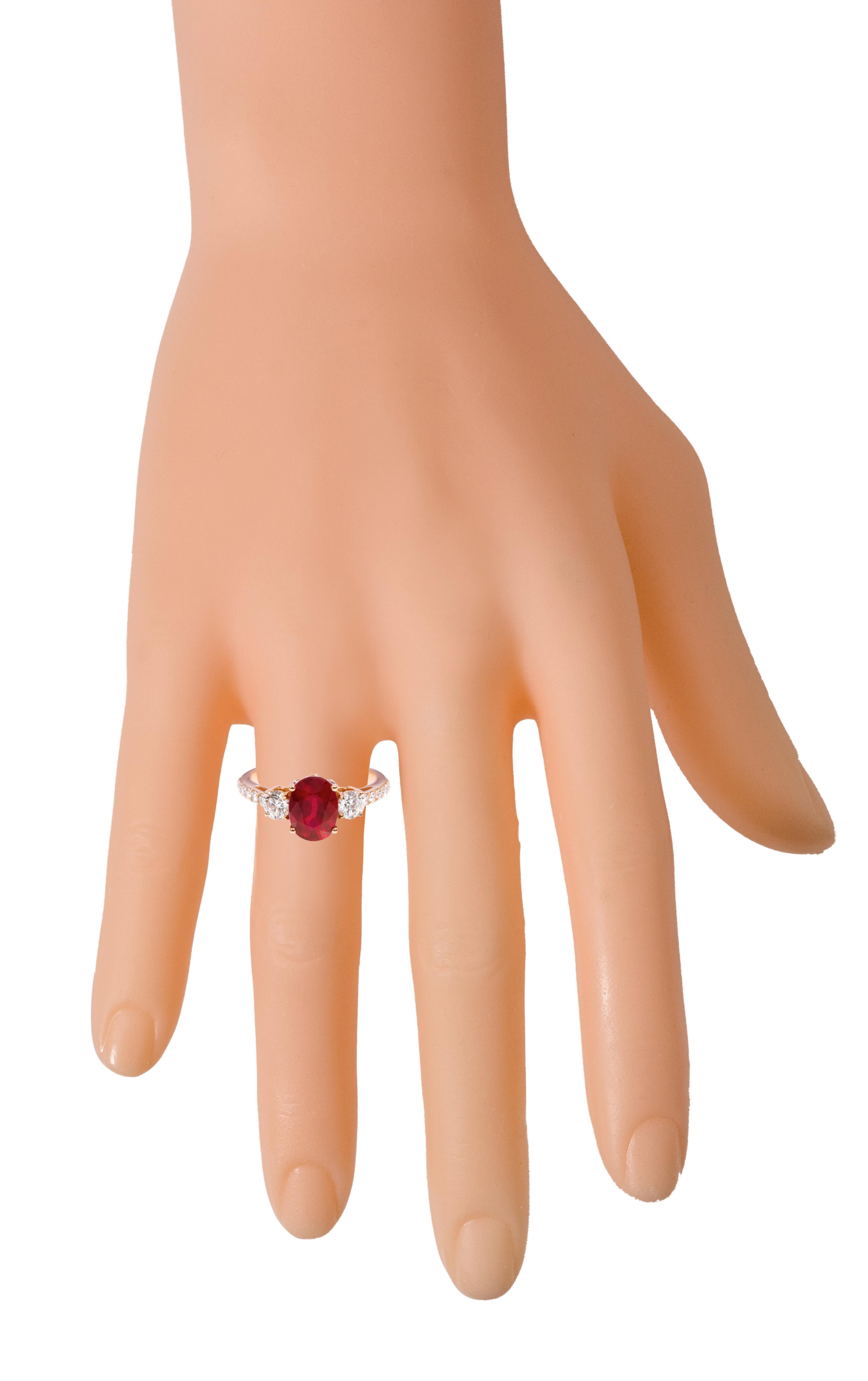 Modern 18 Karat Rose Gold 2.47 Carat Oval-Cut Ruby and Diamond Three-Stone Ring For Sale