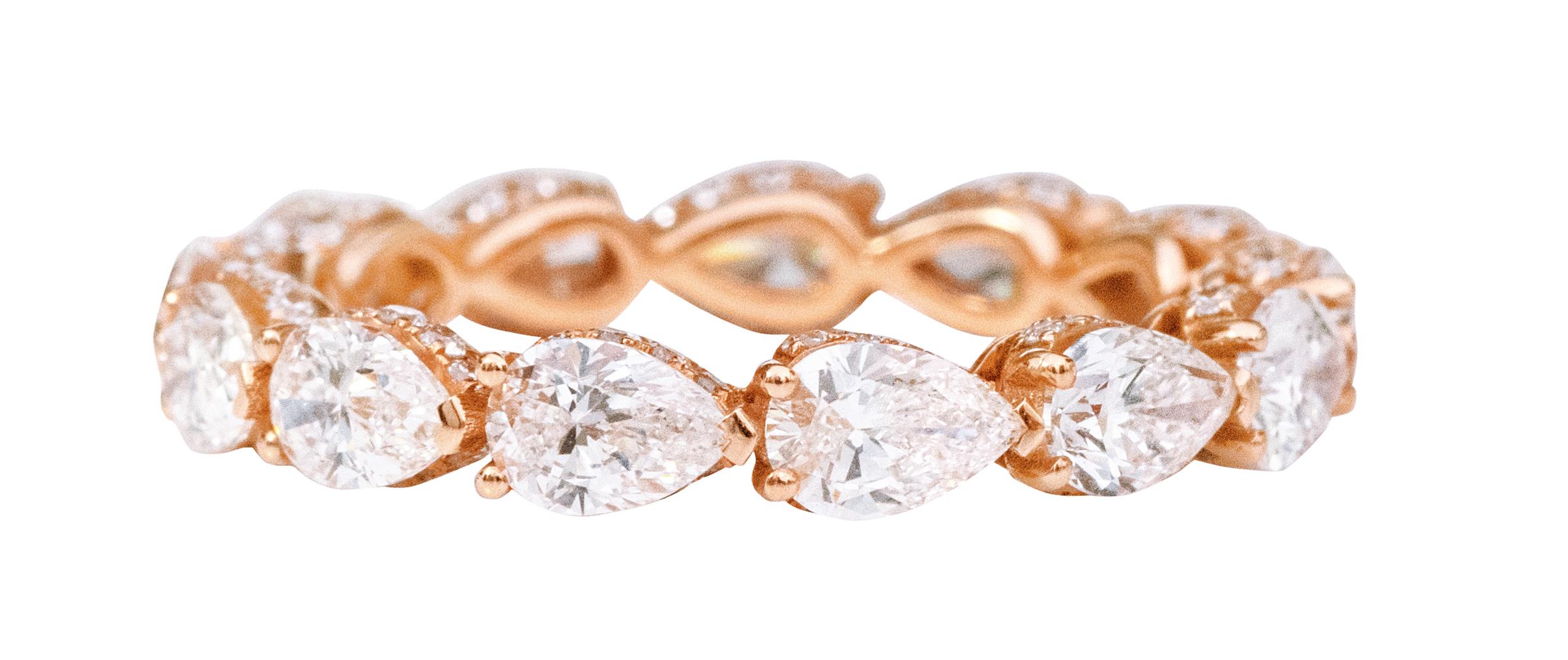 18 Karat Rose Gold 3.63 Carat Solitaire Pear-Shape Diamond Eternity Band Ring

The sparkle of a diamond, the essence of its rarity, all wrapped around your fingers. This unique pear shaped diamond band is all you need to flaunt your style quotient.