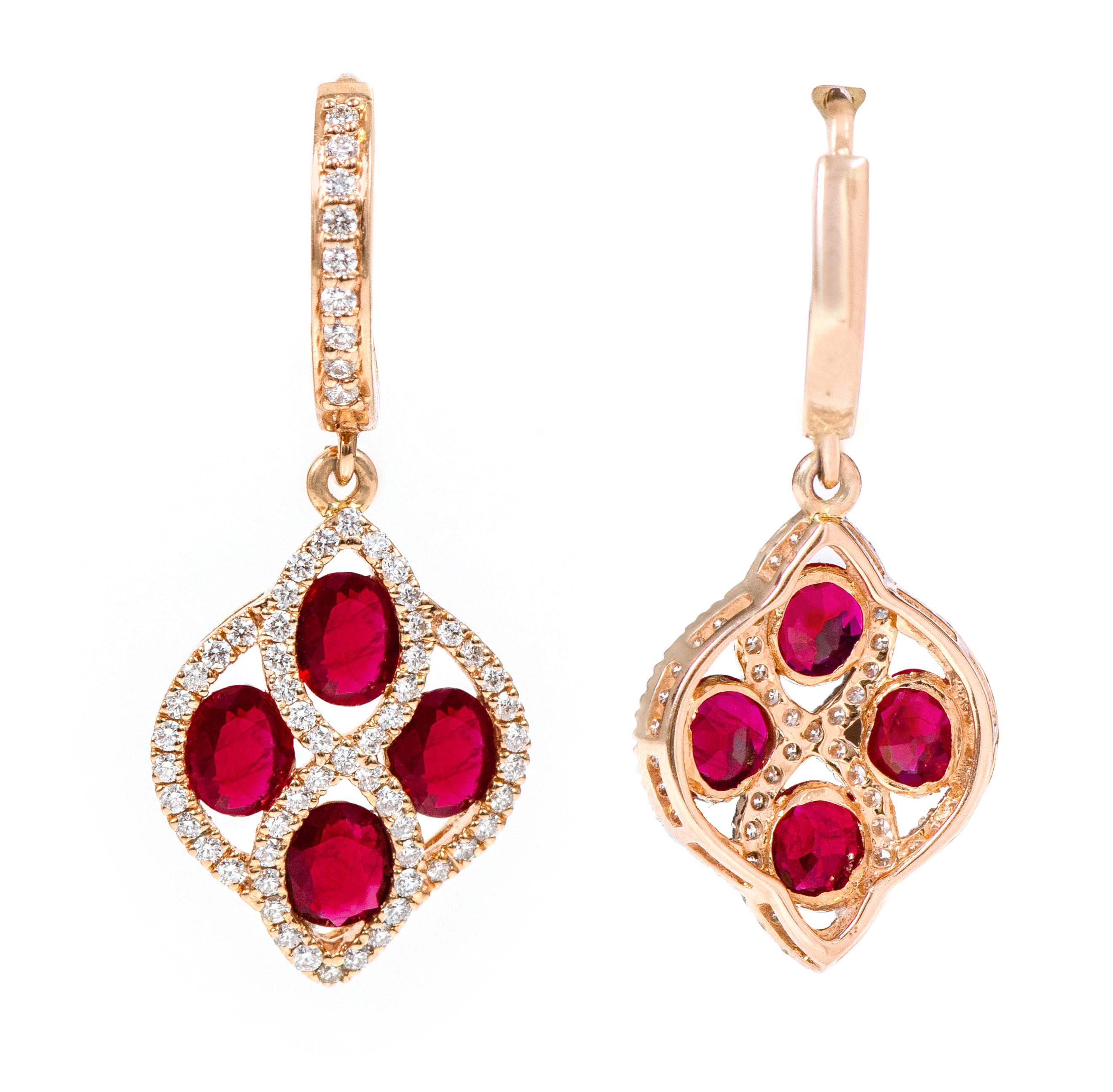 18 Karat Rose Gold 3.76 Carat Ruby and Diamond Dangle Earrings

This impressive scarlet red ruby and diamond hanging earring is incredible. The bottom overall kite shape formed with the beautiful designer element crafted to perfection with the
