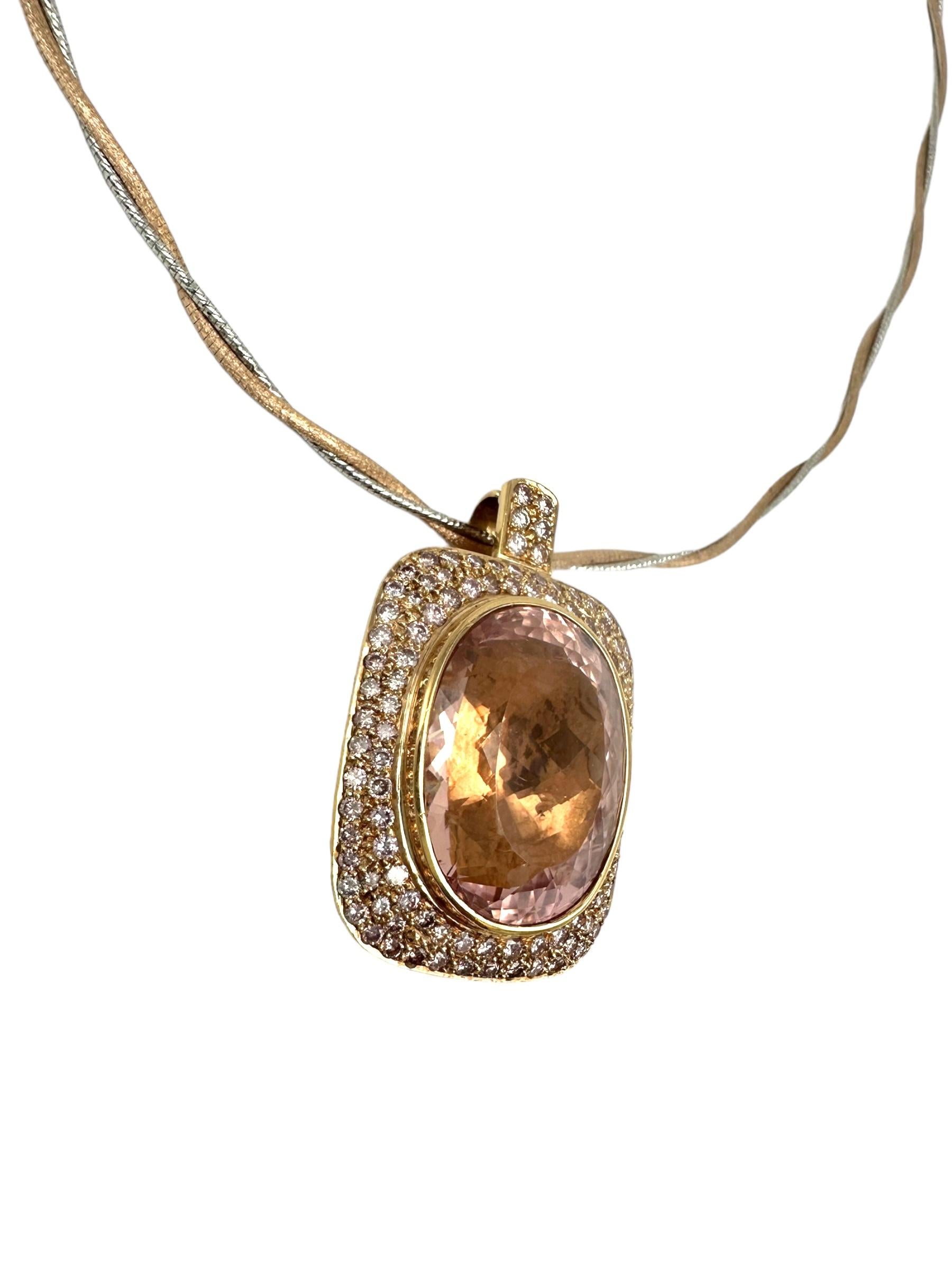 This custom-made 18 Karat Rose Gold necklace features a stunning 44.37-carat Morganite gemstone with a halo of 4.00 carats of round brilliant diamonds. The oval-cut gemstone is expertly faceted for maximum sparkle, making it an eye-catching piece.