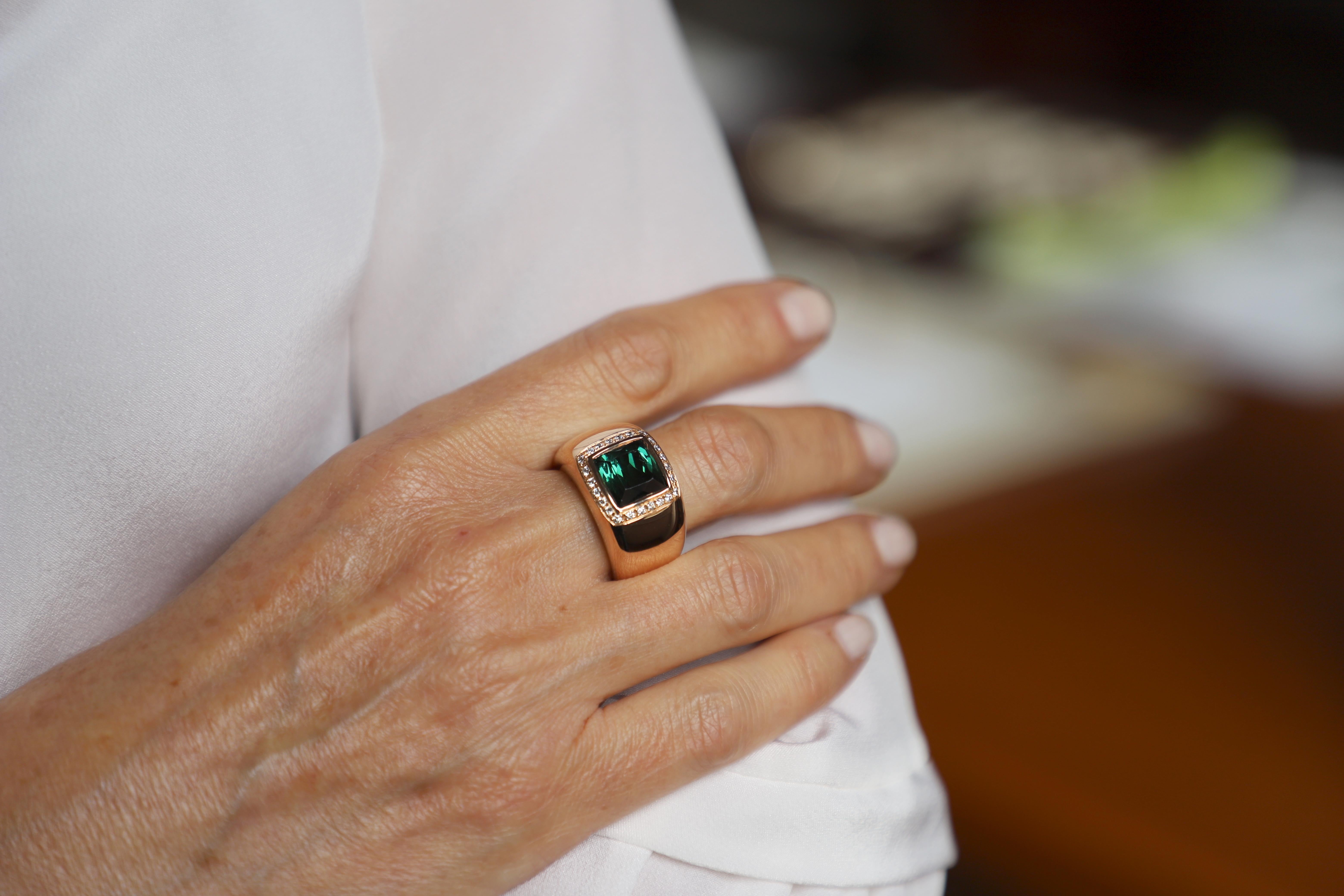 Rossella Ugolini Design Collection, a bold 18 Karat Gold 5 Karat Tourmaline 0.28 Karat White Diamond Design Ring
A deep green 5 karat Tourmaline stone set in a 18 karats rose gold modern band available also in 18 karats yellow gold. This ring