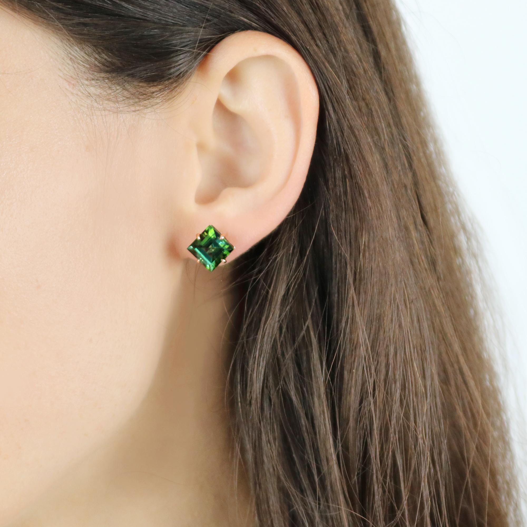 One of a kind emerald cut green tourmaline studs set in 18kt rose gold.

Sparkling, bright and lightweight, this pair of 18kt rose gold studs are meant for everyday use as an unexpected alternative to a classic pair of diamond studs.

The