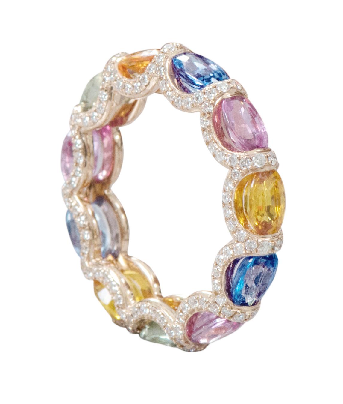 18 Karat Rose Gold 7.61 Carat Multi-Sapphire and Diamond Eternity Band Ring

This impeccable rainbow multi-sapphire and diamond band is incredible. The solitaire horizontally placed oval shape multi-sapphires are brilliantly enclosed in between pave