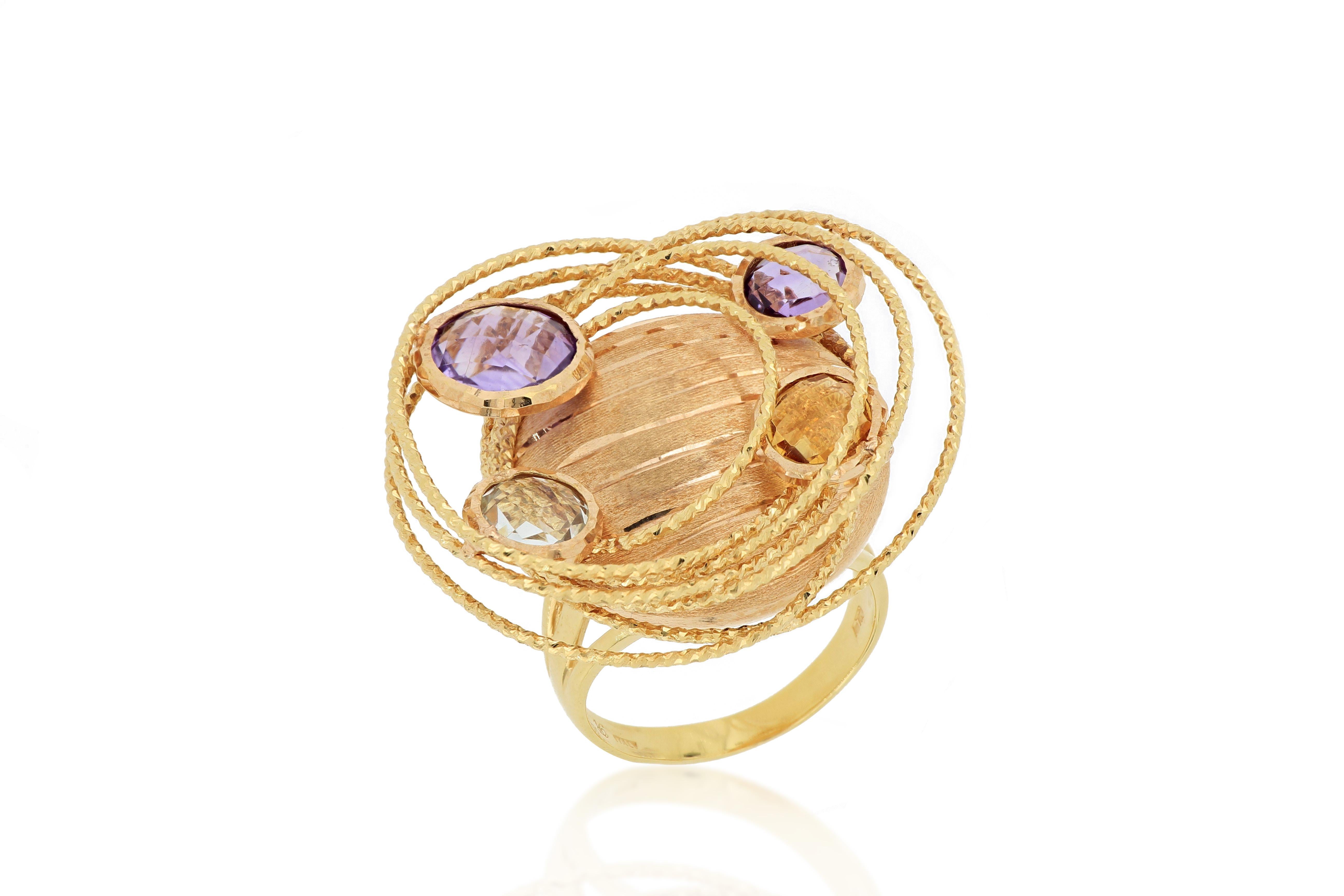 This very special ring is designed and made in Italy, with exquisite workmanship, embellished with amethyst, aquamarine, and topaz, mounted in 18 karat rose gold. A very unique and stylish cocktail ring. 
O’Che 1867 was founded one and a half
