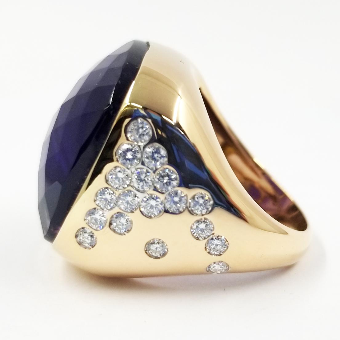 This cocktail ring is crafted in 18 karat rose gold. It features a checkerboard cushion cut Amethyst. One side of the ring contains 18 round diamonds of VS clarity & G color totaling approximately 0.50 carat total weight. Current finger size is 7;