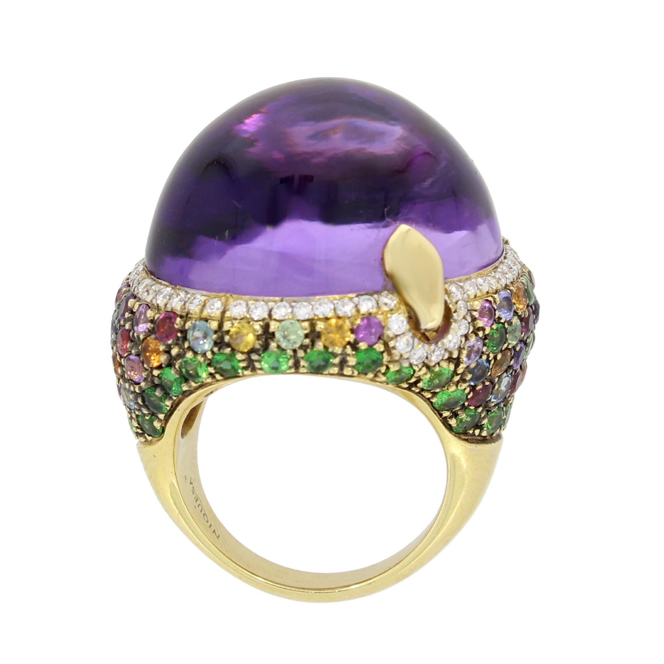 A domed cabochon amethyst encircled by a delicate ring of brilliant cut diamonds, sits above a scintillating rainbow of multicoloured sapphires, punctuated with vivid tsavorites.

Venice Amethyst Ring by Niquesa
Details:
18 karat Rose Gold          