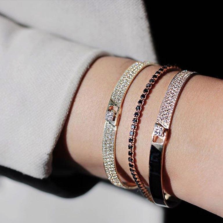 A collection of designs that are timeless and always sought season after season. Bracelets, rings, earrings and necklaces in white, yellow or rose gold adorned with white or black diamonds and at times with a dash of rubies. Worn stacked on their