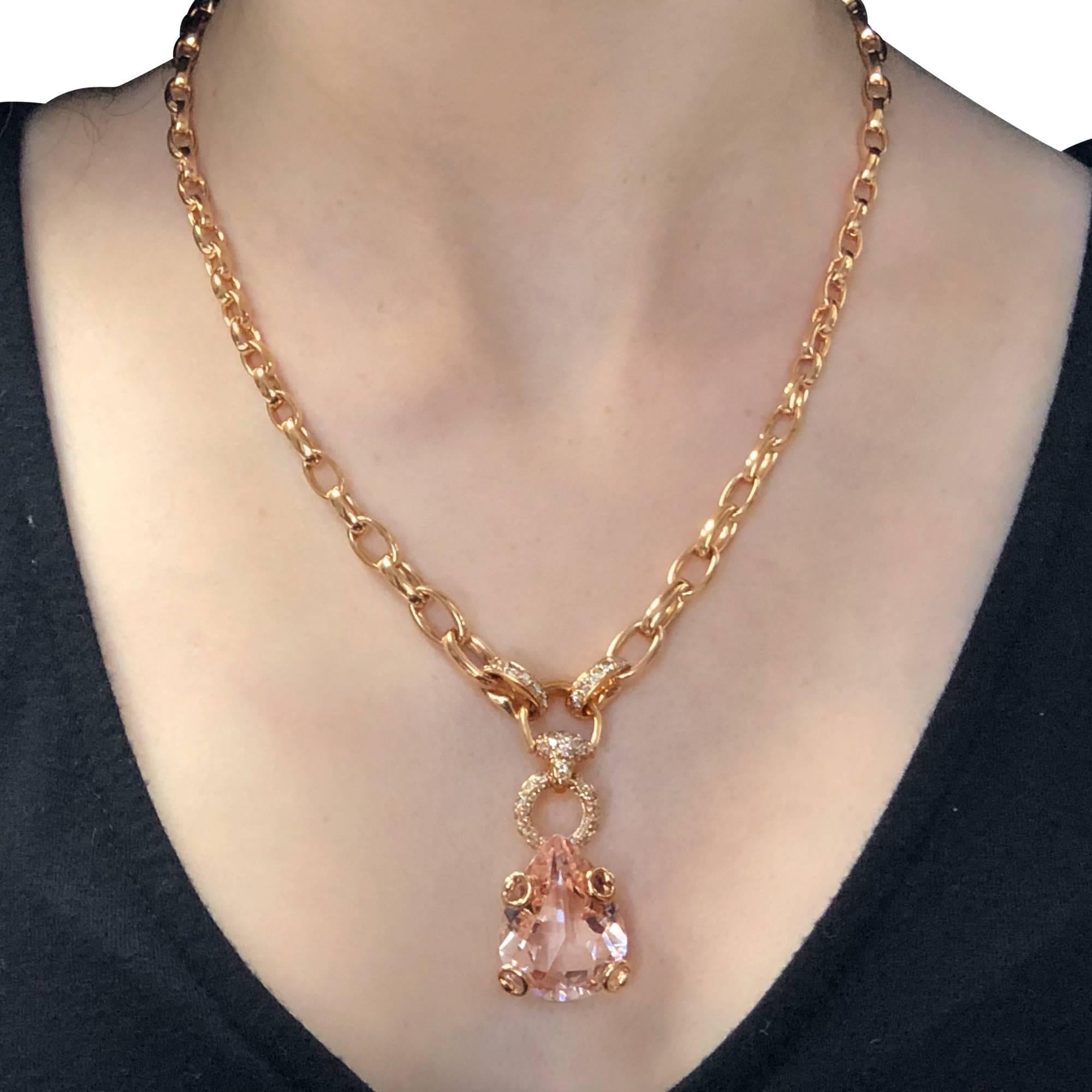 From the house of Gucci, this gorgeous 18 Karat Rose Gold necklace showcases a magnificent pear shape morganite, measuring approximately 1 inch by .8 of an inch accented by 62 round brilliant cut diamonds. The necklace is 17.5 inches in length, and