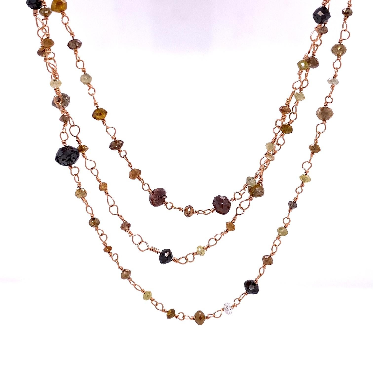 An 56 inch 18k rose gold wired necklace with multicolor diamonds, 28.01 total carat weight. This necklace was designed and made by llyn strong.