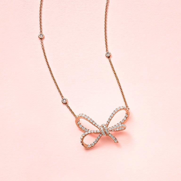 Women's 18 Karat Rose Gold and White Diamonds Bow Pendant For Sale