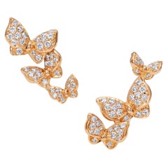 Boucles d'oreilles papillon en or rose 18 carats et diamants blancs