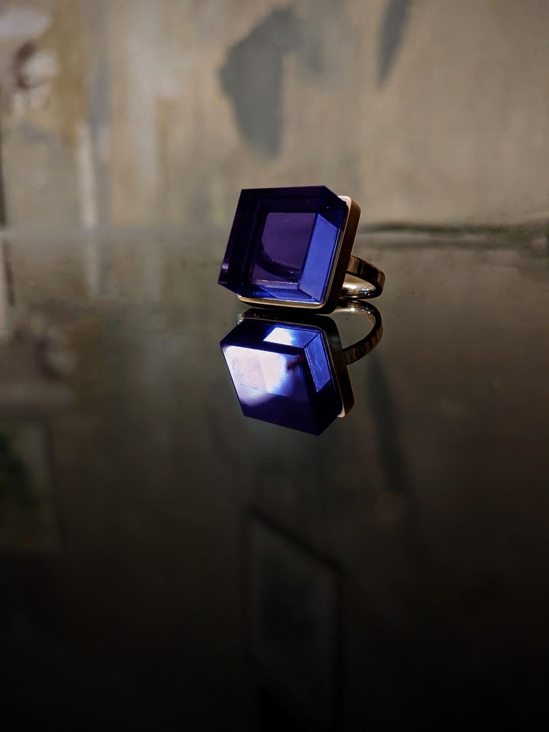 This Art Deco Style men's ring is crafted in 18 karat rose gold and features a 15x15x8 mm dark grown amethyst. The piece has been featured in Harper's Bazaar and Vogue UA. The ring is available in other colors, such as green amethyst, natural purple