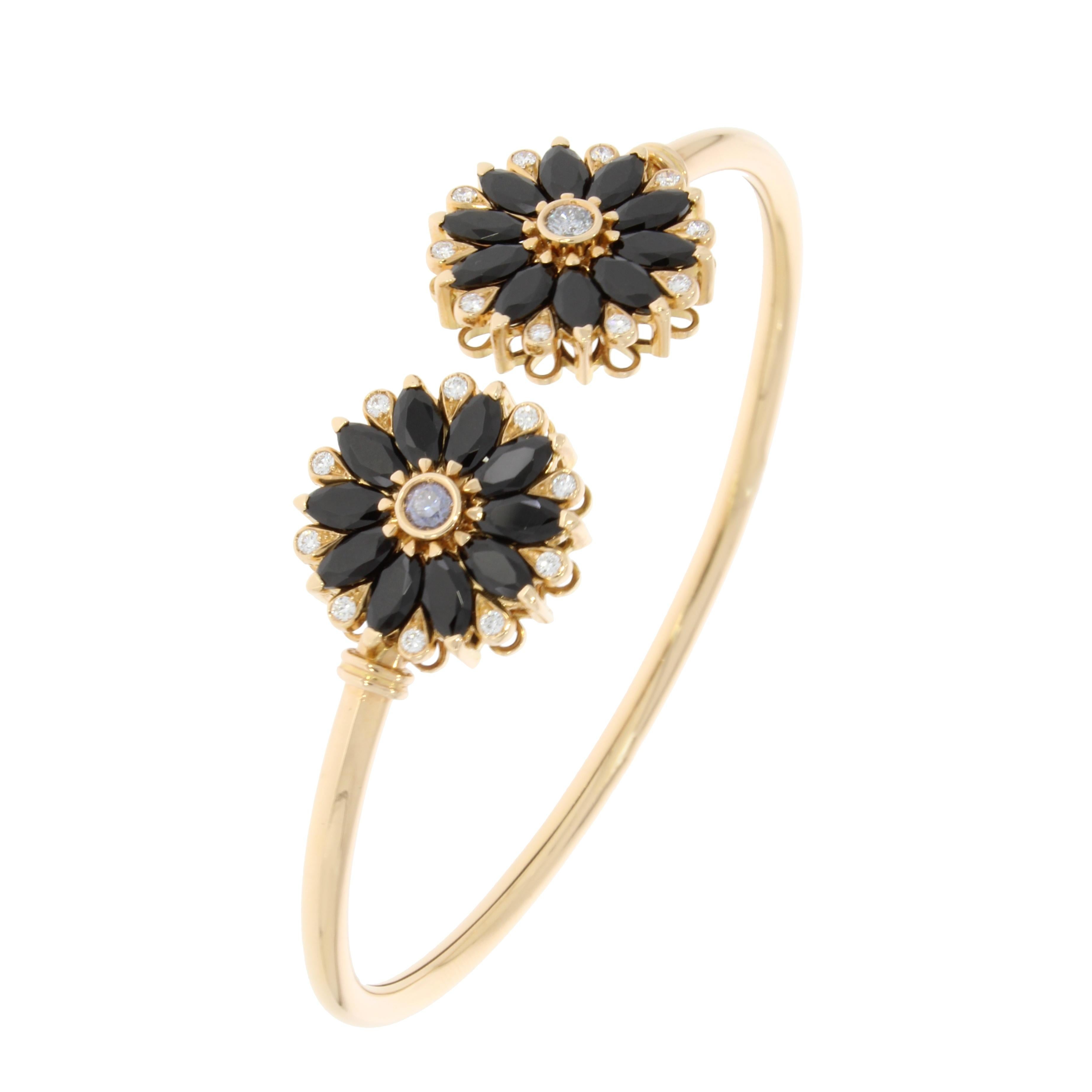 A sleek bangle with two exquisite flowers in bloom honoured with marquise cut black spinels separated with brilliant cut diamonds, capturing the delicate beauty of nature.

Dalia Bangle details:
- 18 Karat Rose Gold
- 5.08 Carat Marquise Black