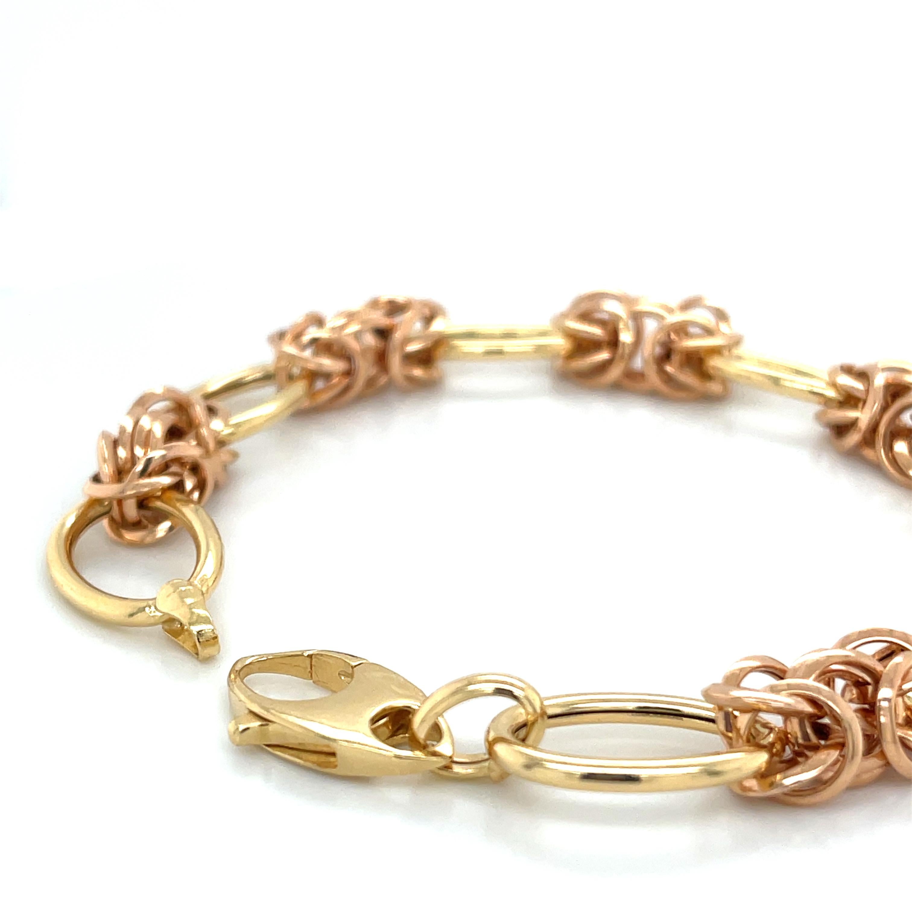 18k yellow and rose gold, 7.25 inches / 18.4 cm long, Byzantine chain-link bracelet.  

This elegant bracelet showcases a Byzantine-style chain pattern intertwined with oval-link circles, creating a harmonious blend of texture and elegance. A