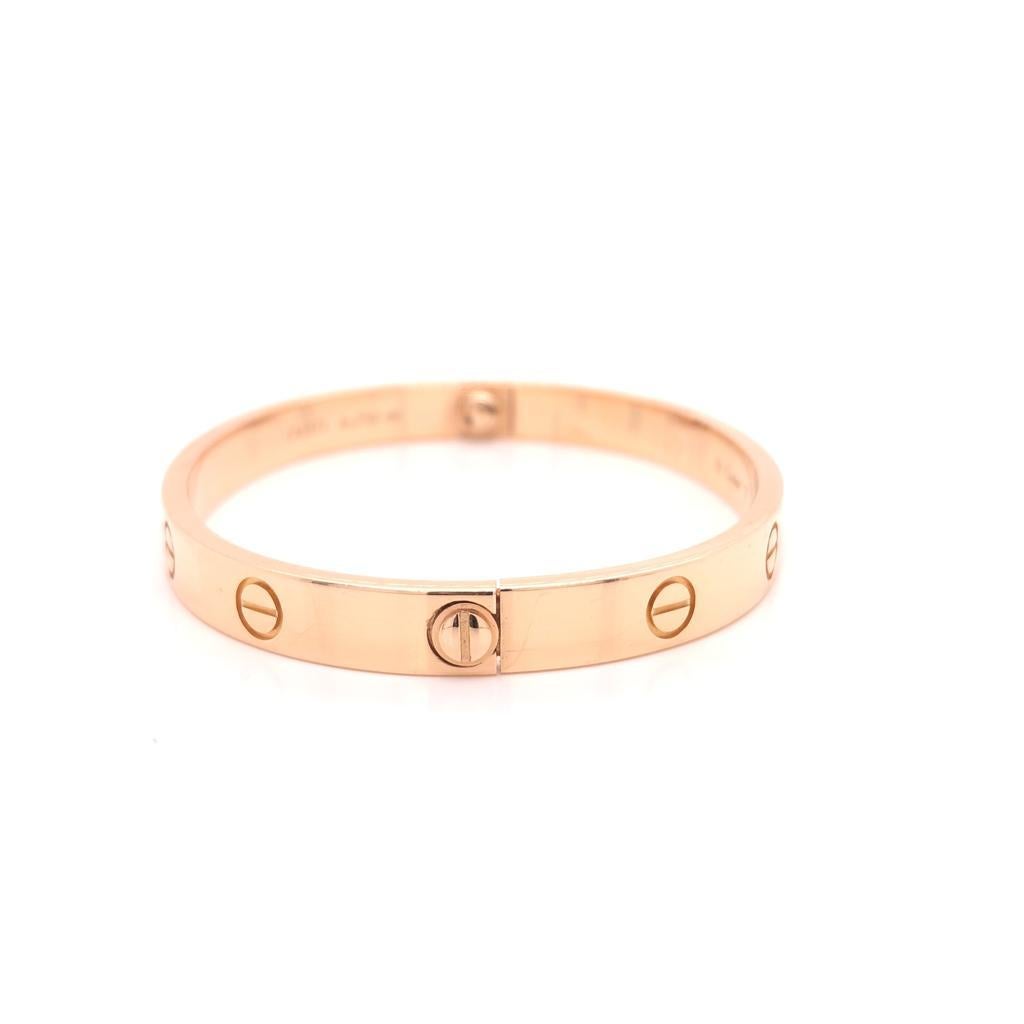 18 Karat Rose Gold Cartier Love Bracelet  Bangle 
Size: 17 
Reference number: B6035617
Comes with a screwdriver. Width: 6.1mm.
Box and Papers  Comes with CERTIFICATE 
About the collection:
A child of 1970s New York, the LOVE collection remains today