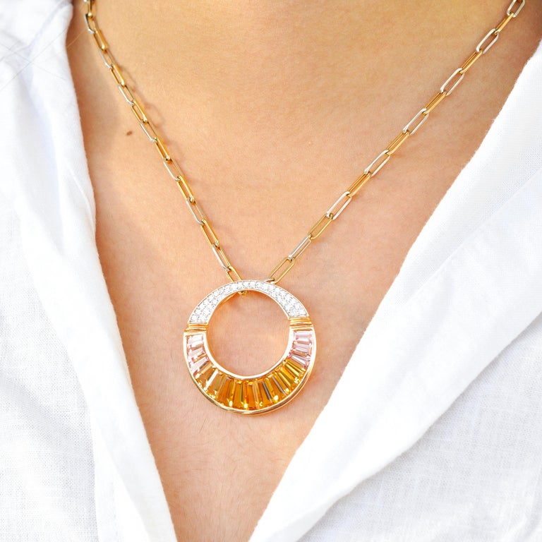18 karat rose gold citrine peach tourmaline baguette diamond pendant necklace brooch.

This 18 karat rose gold citrine peach tourmaline baguette and diamond circular pendant / brooch is inspired by the necklace worn by Cleopatra in the Egyptian Era,