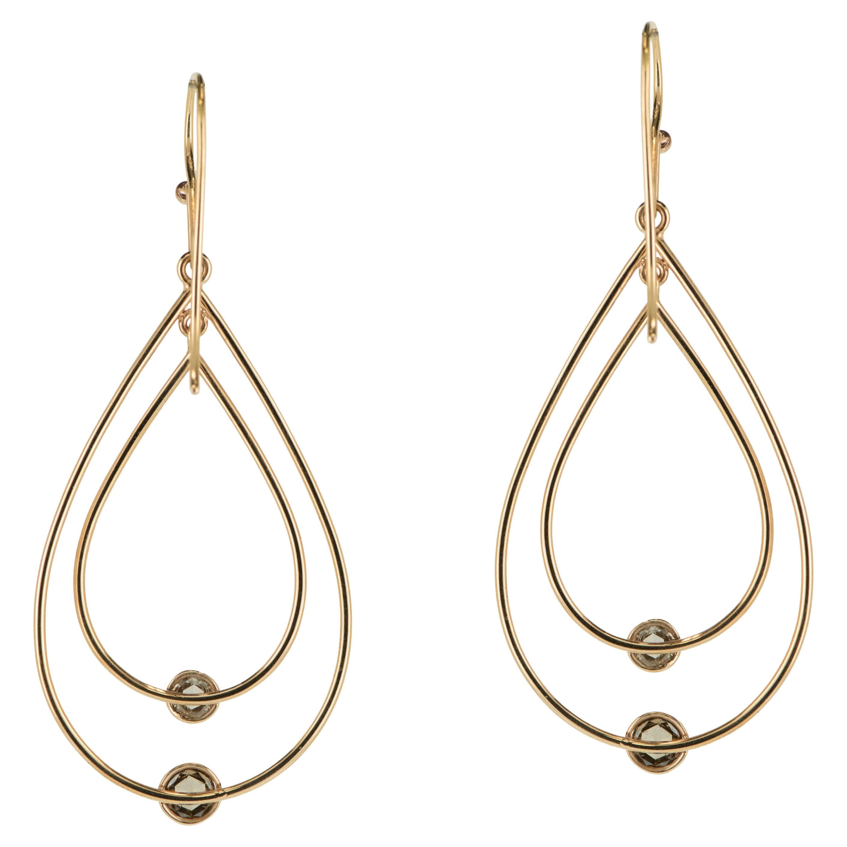 Measuring approximately 1 inch in length, these 18 Karat Rose Gold Dangle Earrings with Cognac Diamonds are the perfect addition to any jewelry collection. The rose cut diamonds and rose gold accents work together to create a stunning display that