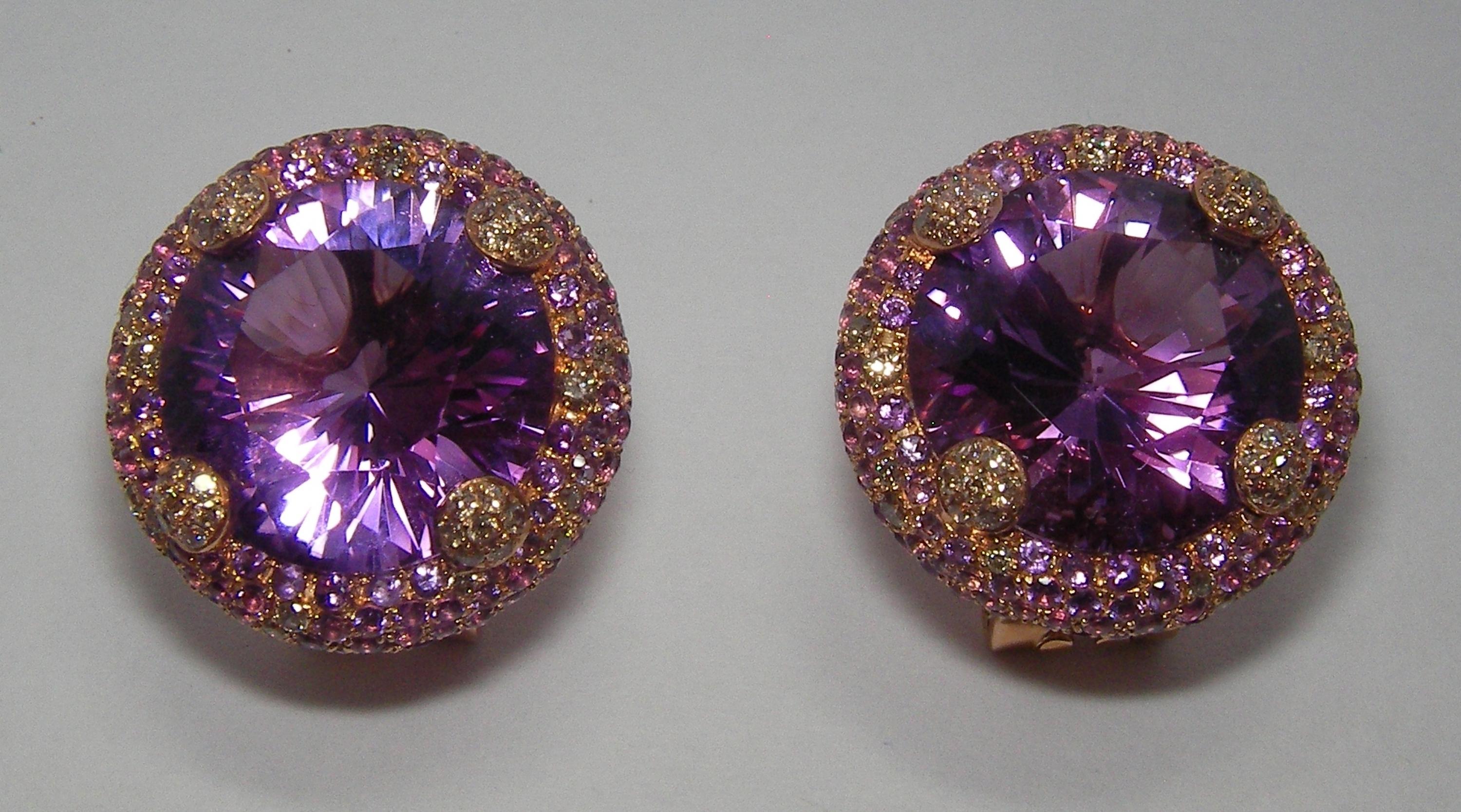 These 18 Karat Rose Gold Earrings are embellished with elegant Cognac colored Diamonds and Amethyst. A dazzling 8.8 Carat round cut Amethyst serves as a center stone on each earring. These is a perfect compliment to our matching Rose Gold, Diamond,