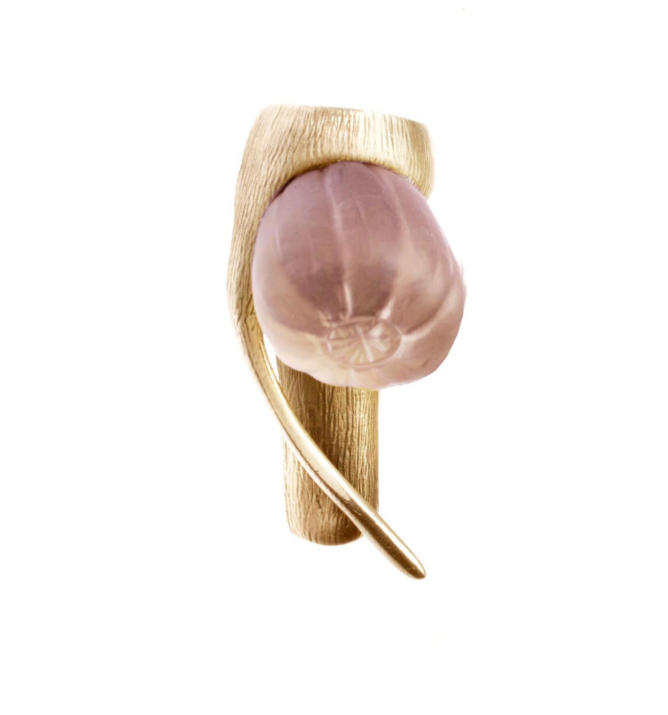 This brooch is a perfect accessory for the fall season, adding a touch of elegance and sophistication to any outfit. The frosted rose quartz adds a delicate and feminine touch to the bold and unique design of the fig fruit. The use of 18 karat rose