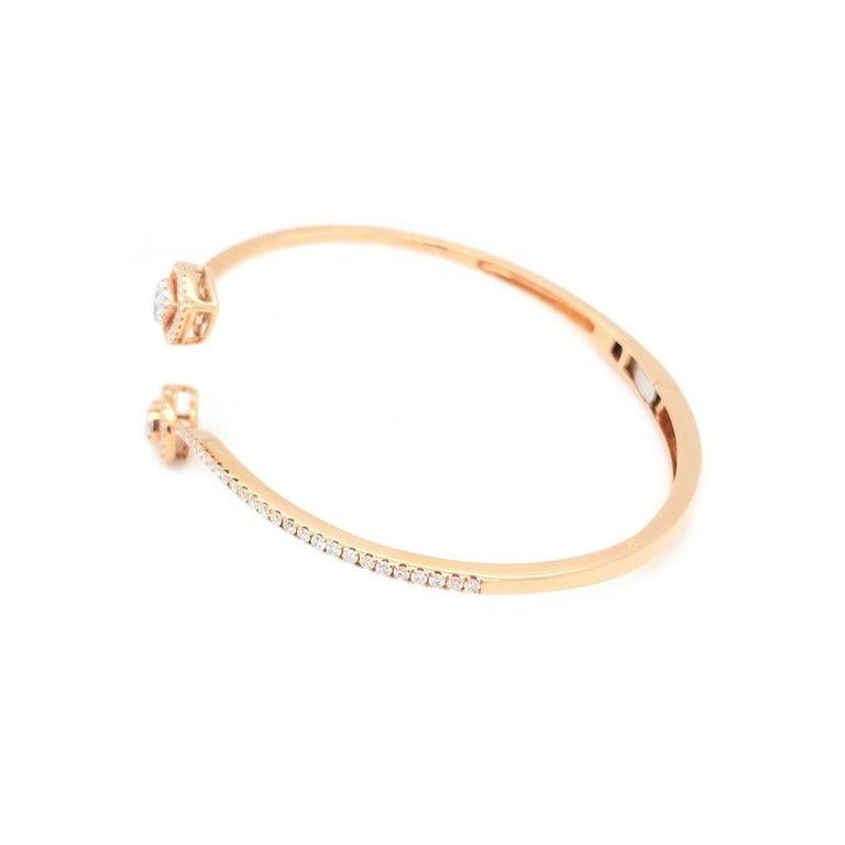 18k Rose Gold Crossover Bangle Pear Ends. With 116 Round Diamonds Totaling 0.79 Carat Total Weight. 6 Baguettes Diamonds Totaling 0.20 Carat Total Weight. All Together, Diamond Total Weight Is 0.99 Carats With G-H Color And VS1-SI Clarity.